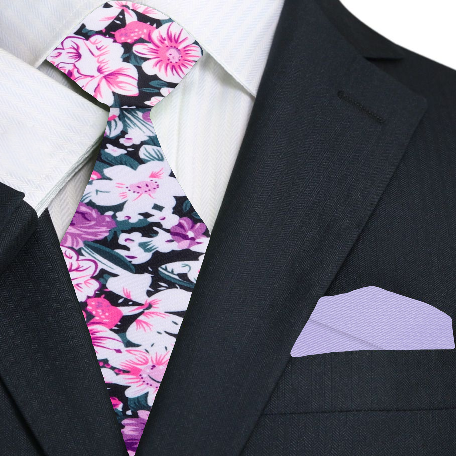 Man wearing floral silk tie with light pink dress shirt at outdoor wedding
