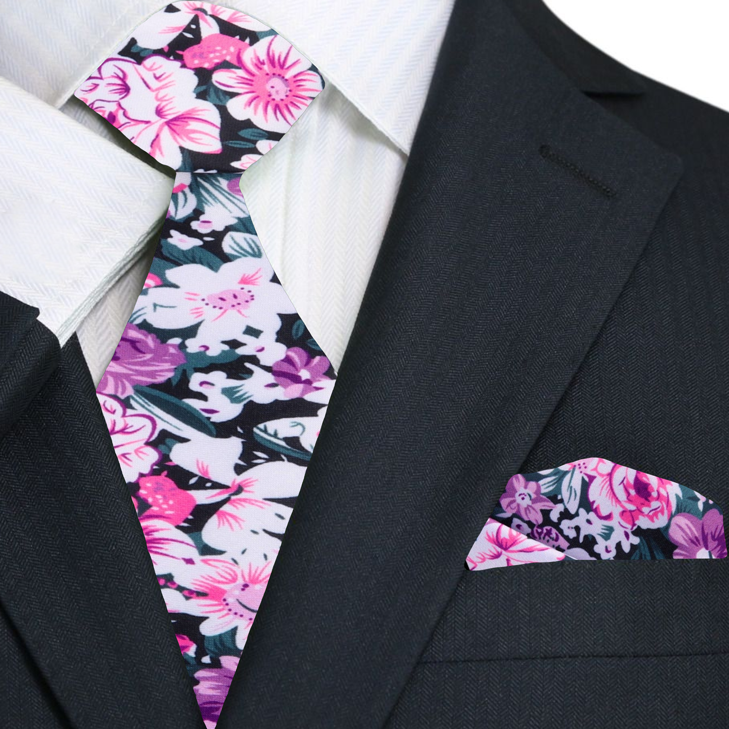 Man wearing floral silk tie with light pink dress shirt at outdoor wedding
