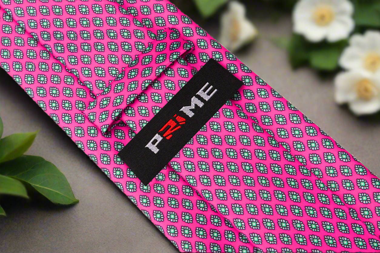 Man wearing silk watermelon tie with white shirt and navy suit—ideal for formal wear