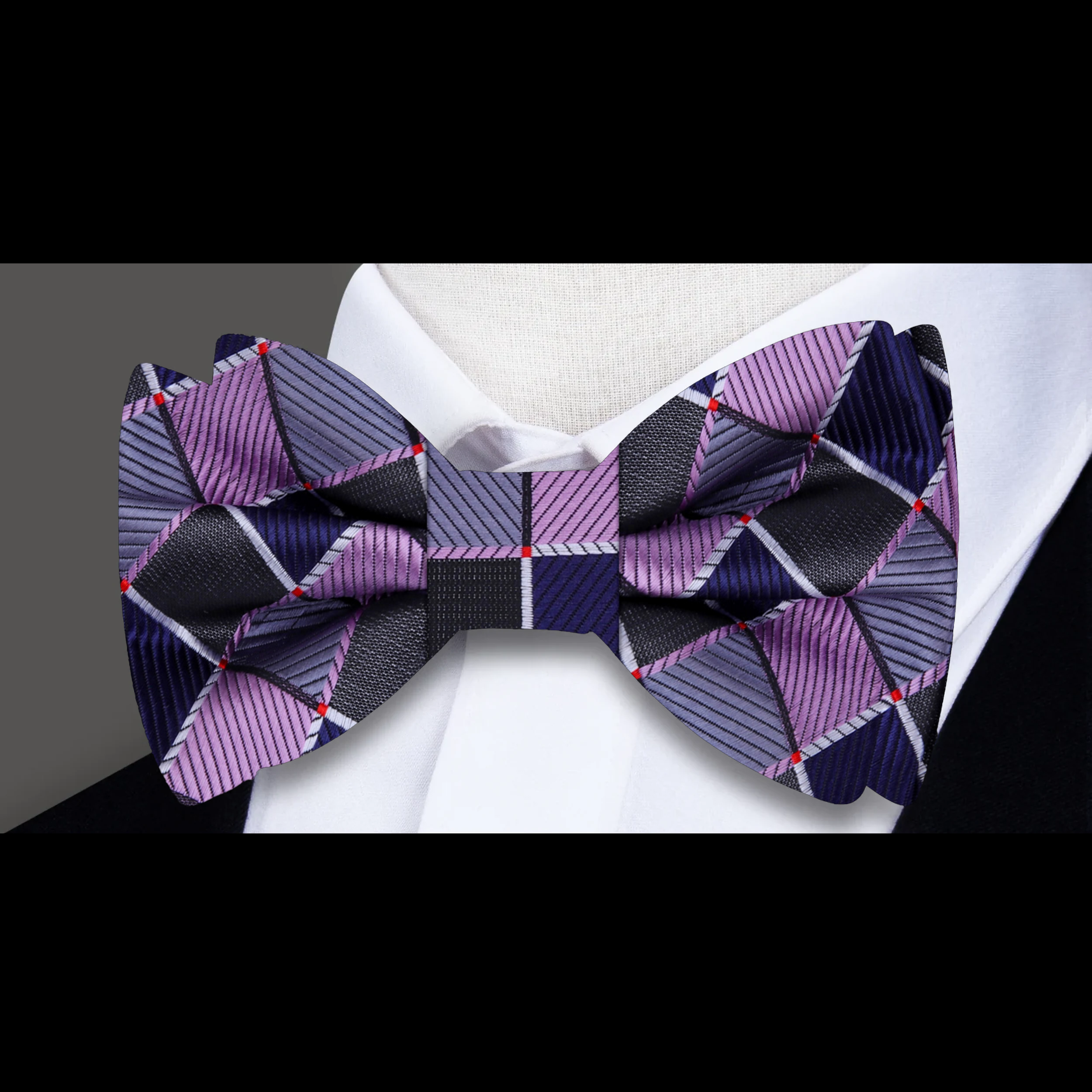 Close-up of a premium geometric bow tie showcasing intricate pattern and silk fabric