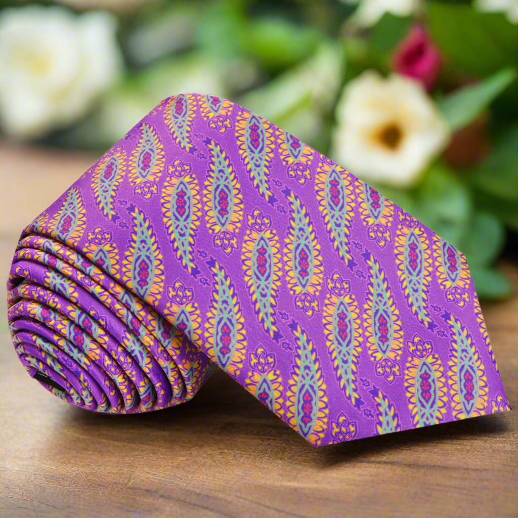 Close-up of vibrant paisley silk tie with jalapeño pattern, ideal for outdoor weddings