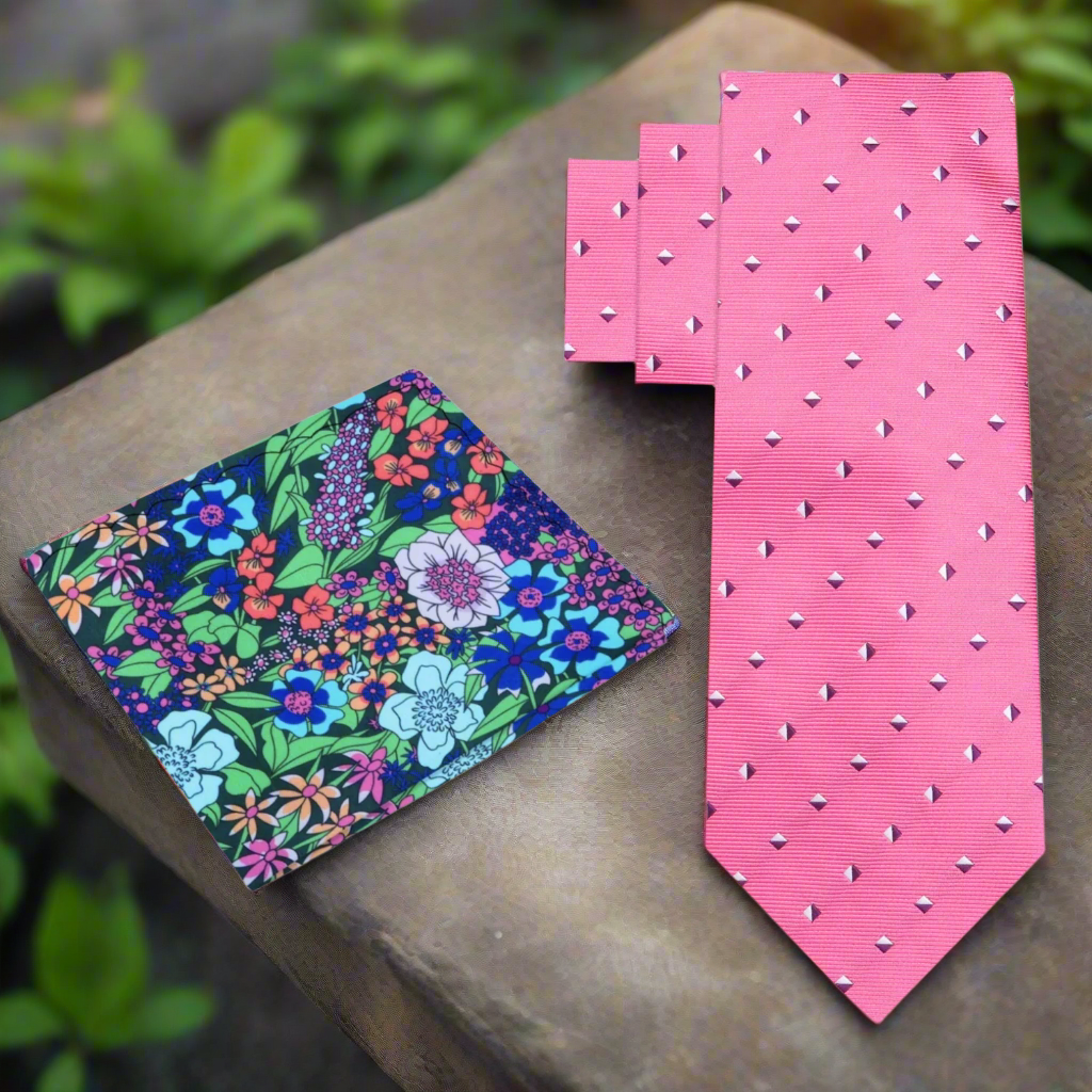 Front view of the chic pink geometric silk tie draped elegantly over a white dress shirt.