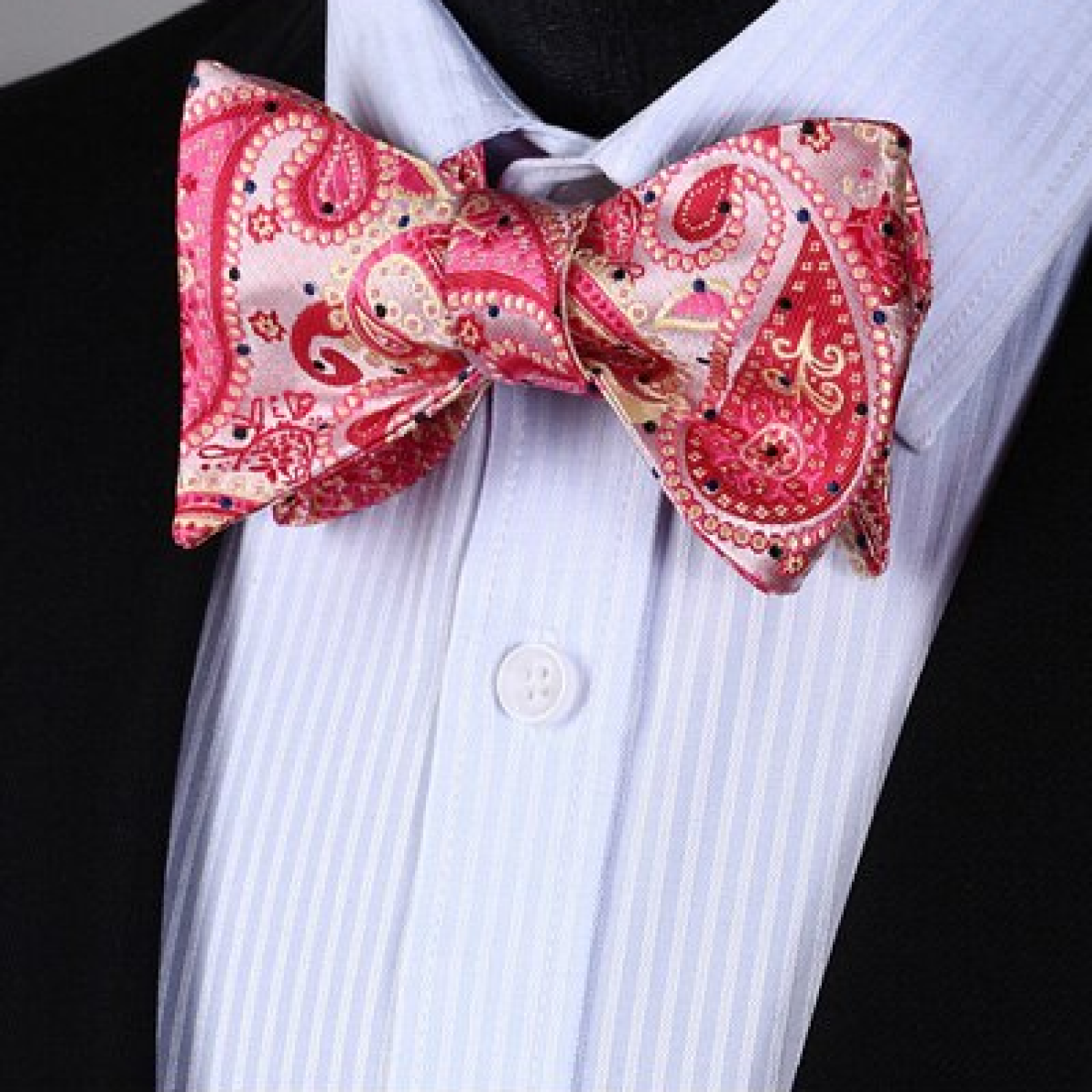 A vibrant silk bow tie styled with a crisp white dress shirt for an elegant look.