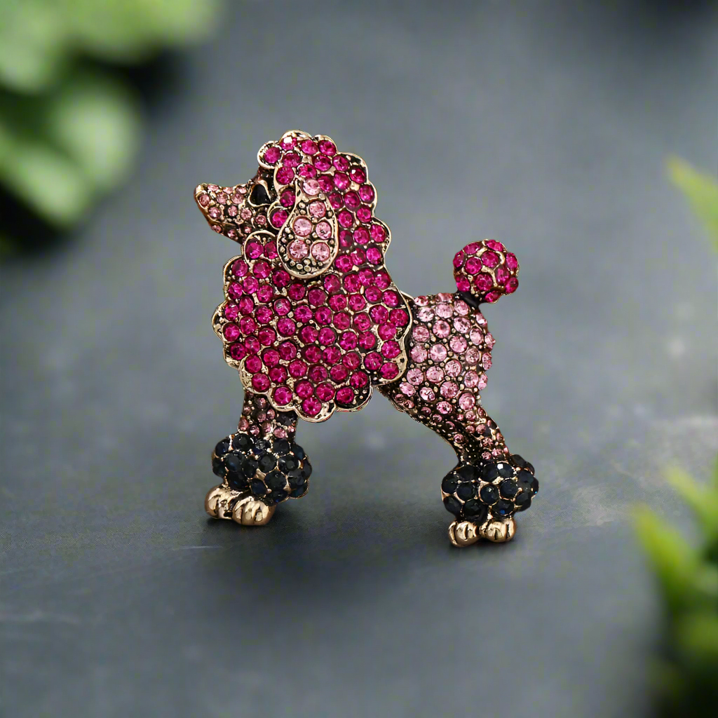 Close-up of a pink poodle lapel pin on a crisp white shirt, showcasing its playful design.