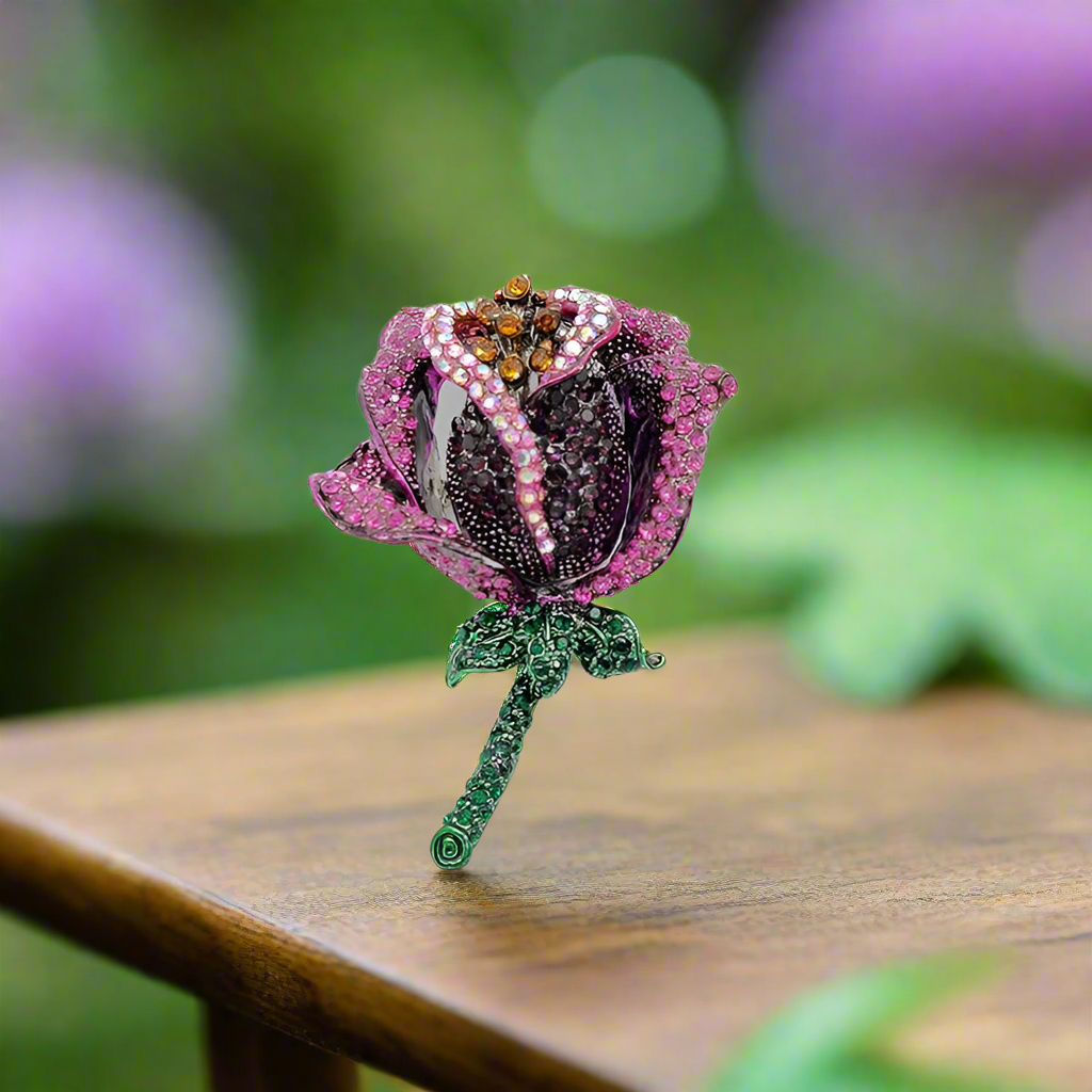 Elegant rose lapel pin in classic red, perfect for formal suits.