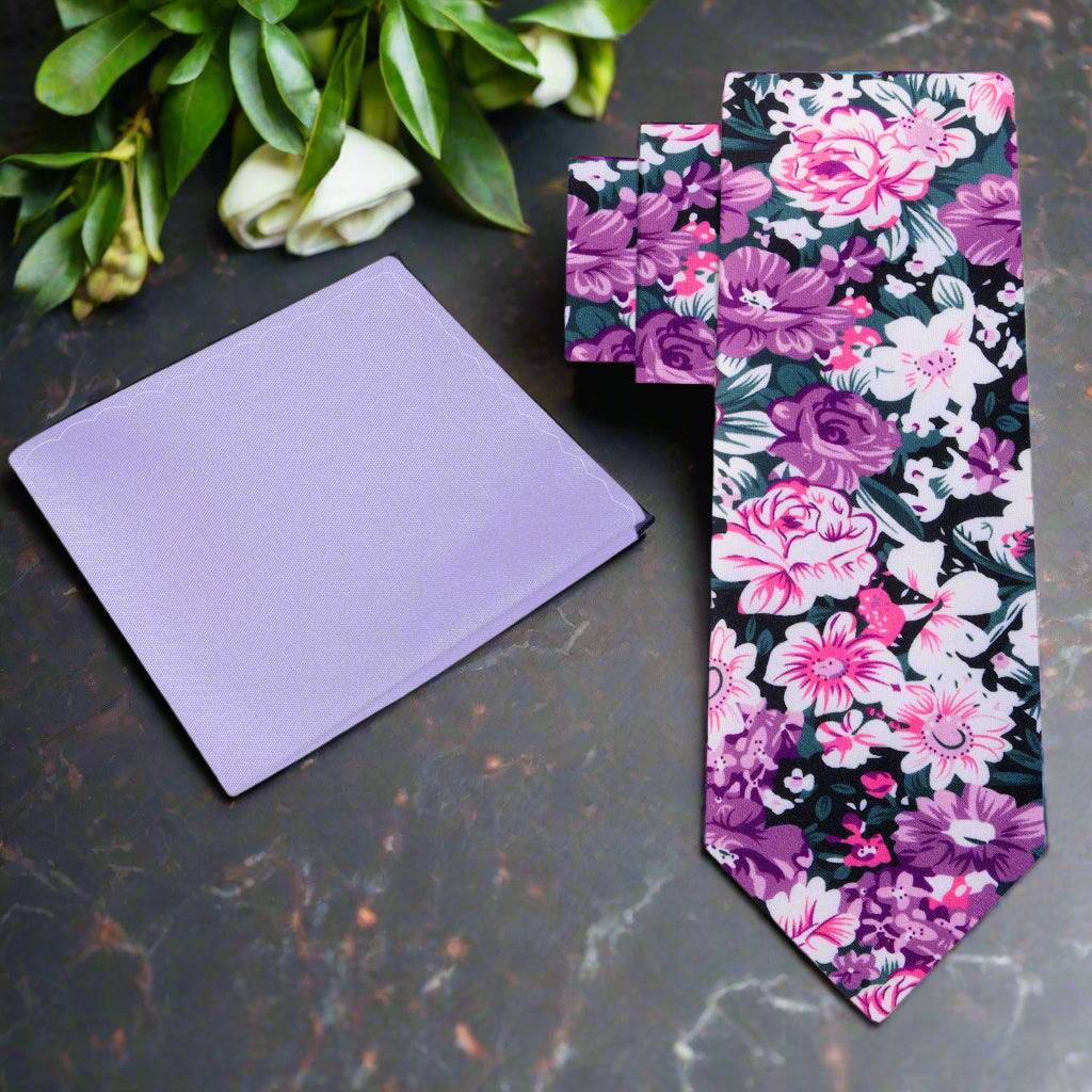 Front view of pink floral silk tie with green and white accents, ideal for garden parties