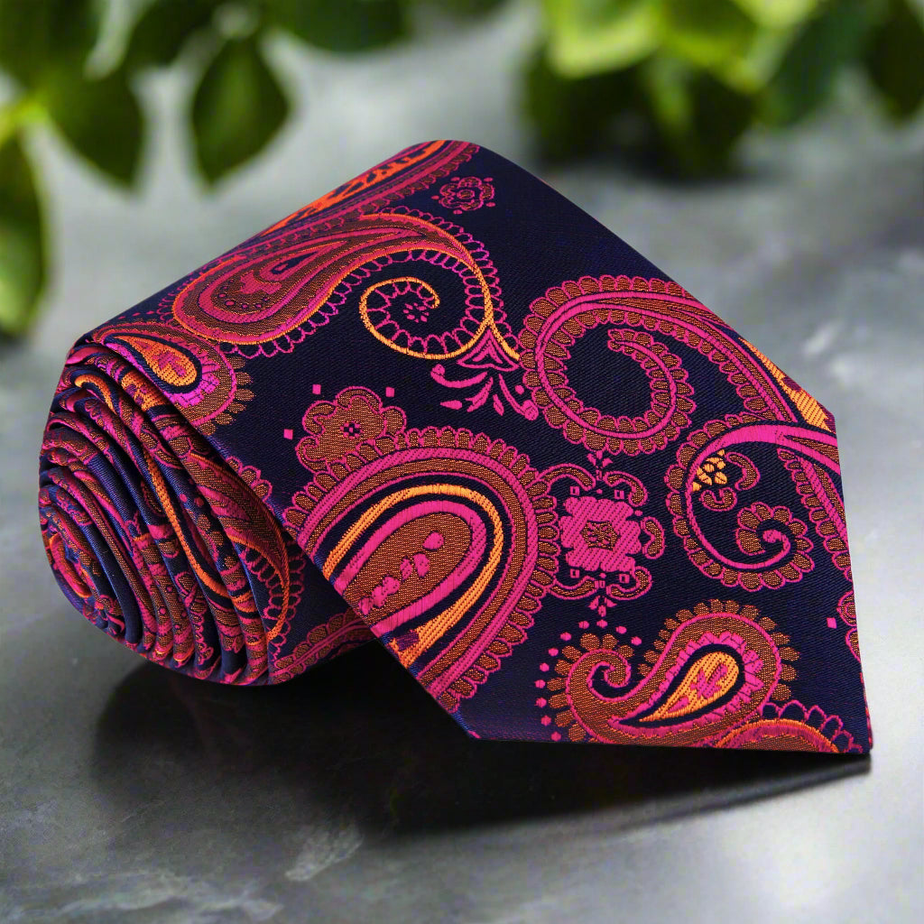 Close-up of blue silk paisley necktie with gold pattern for formal occasions