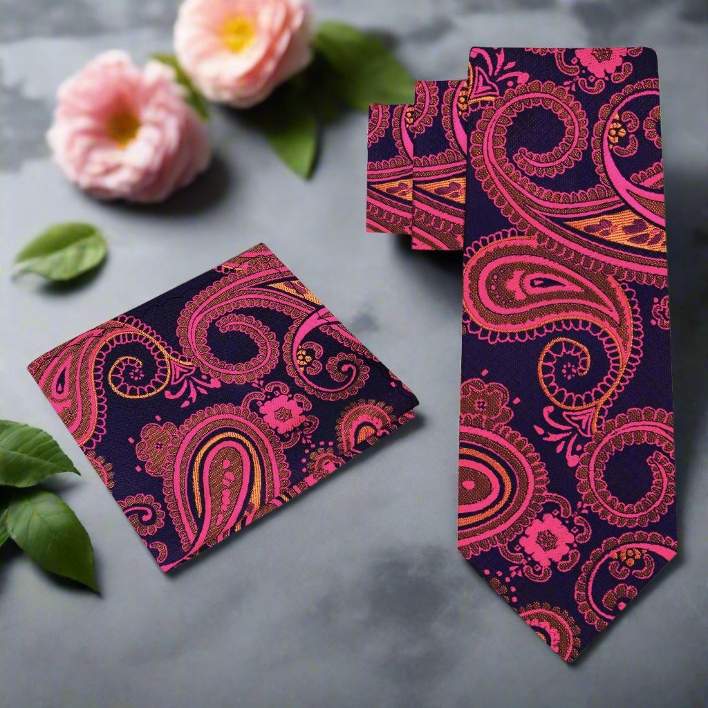 Elegant navy blue suit with matching paisley silk necktie and pocket square