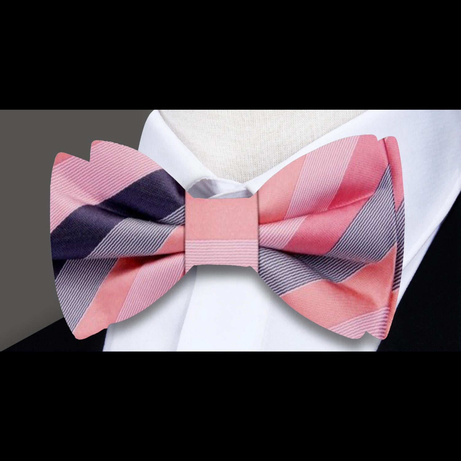 Elegant pastel striped bow tie styled on a crisp white dress shirt.