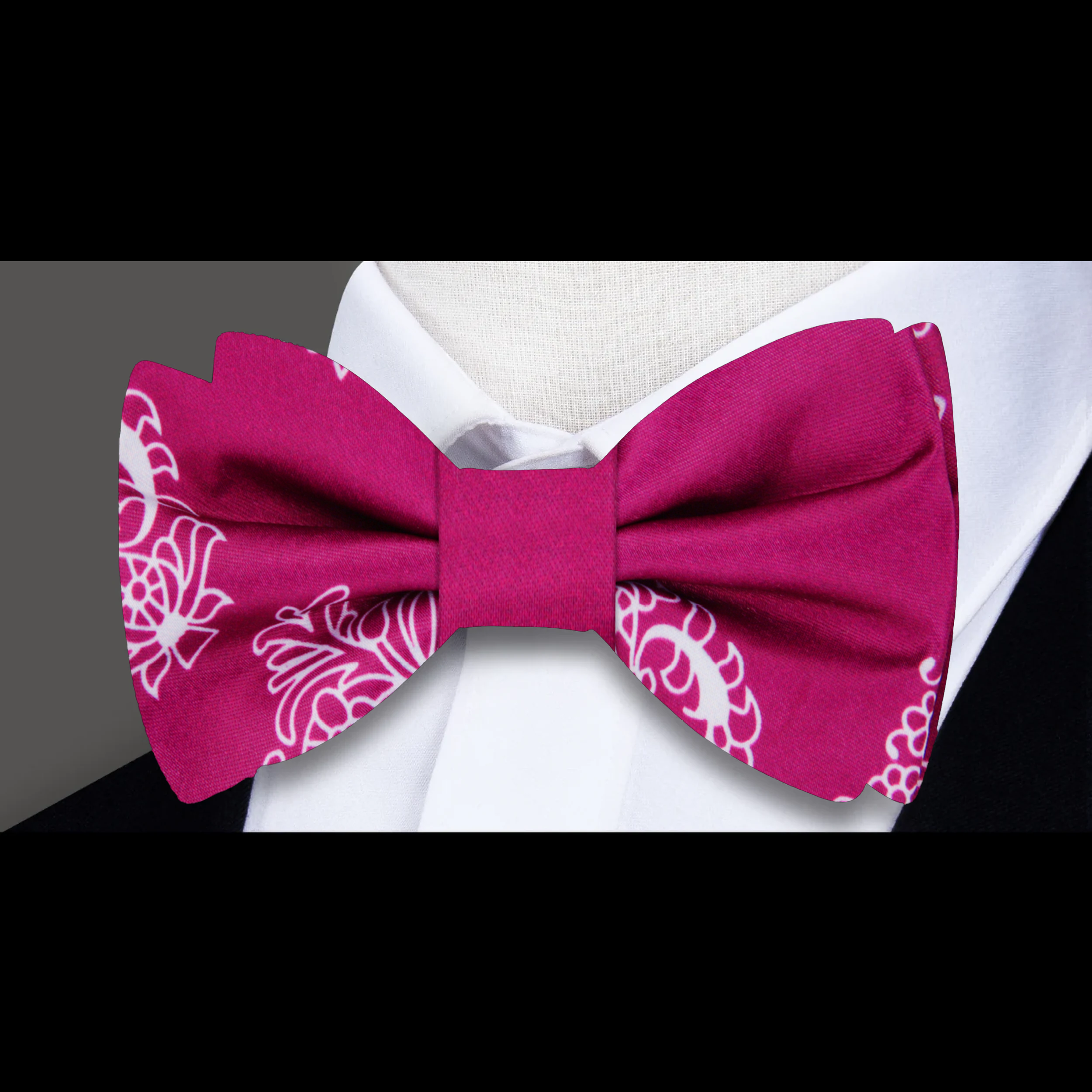 Model wearing a silk paisley bow tie with a white dress shirt for a western wedding