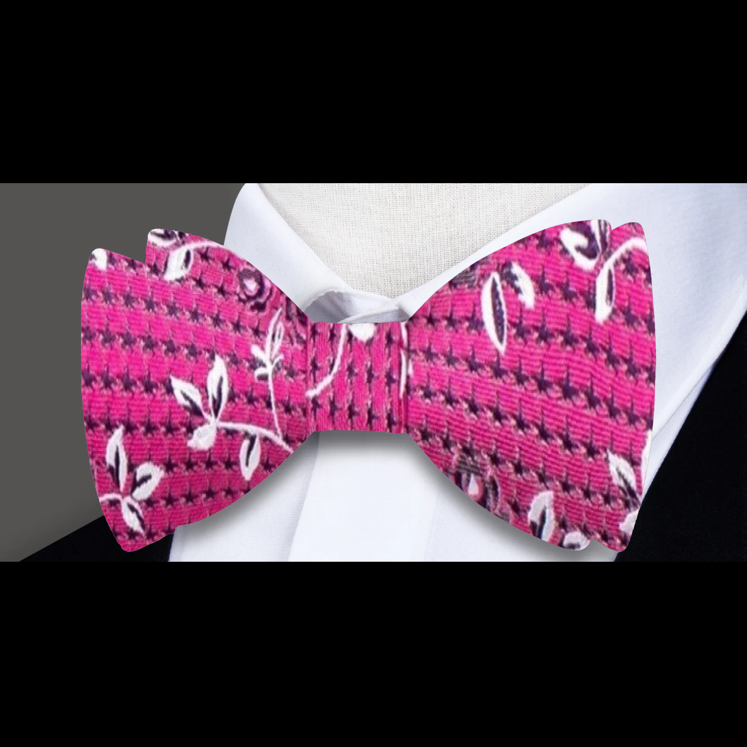 Close-up of detailed floral pattern on the self-tie bow tie for garden party look