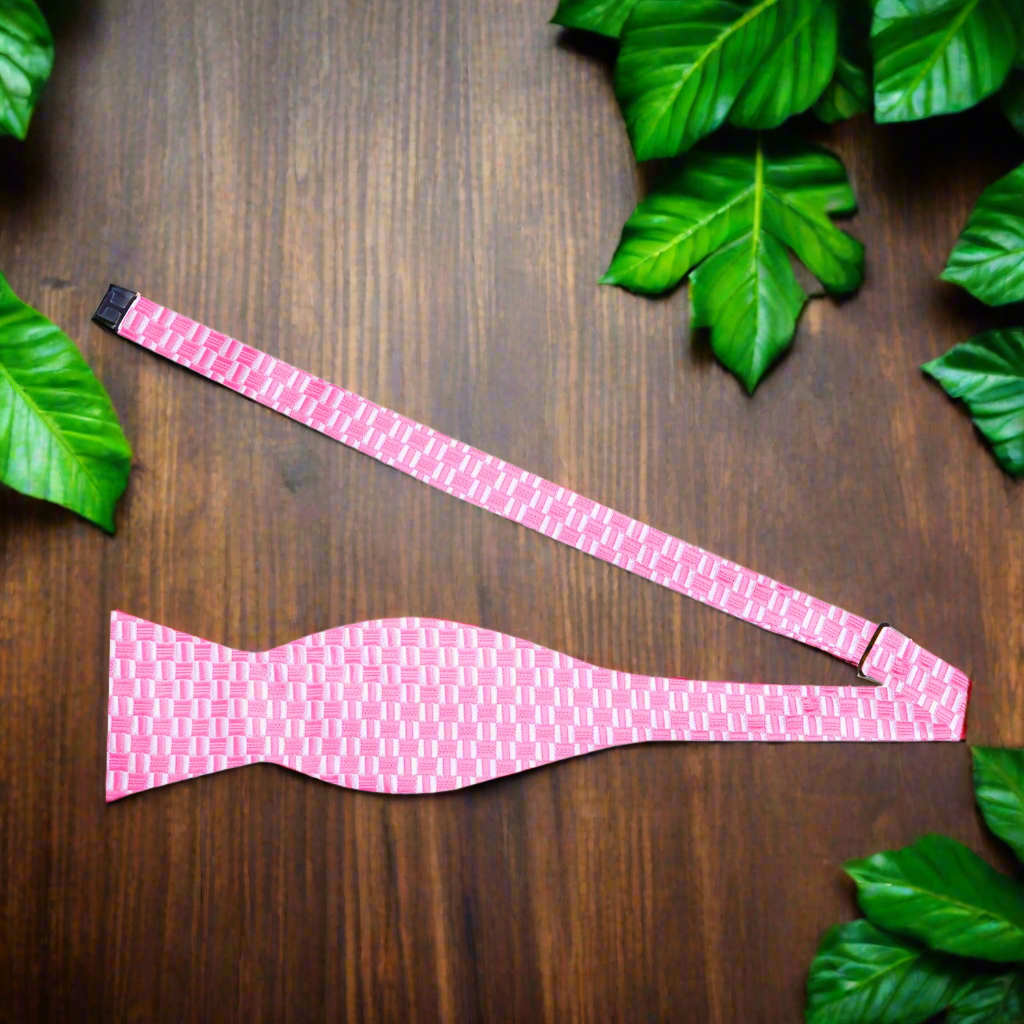 Self-tie bow tie elegantly paired with a matching pocket square, perfect for formal events.