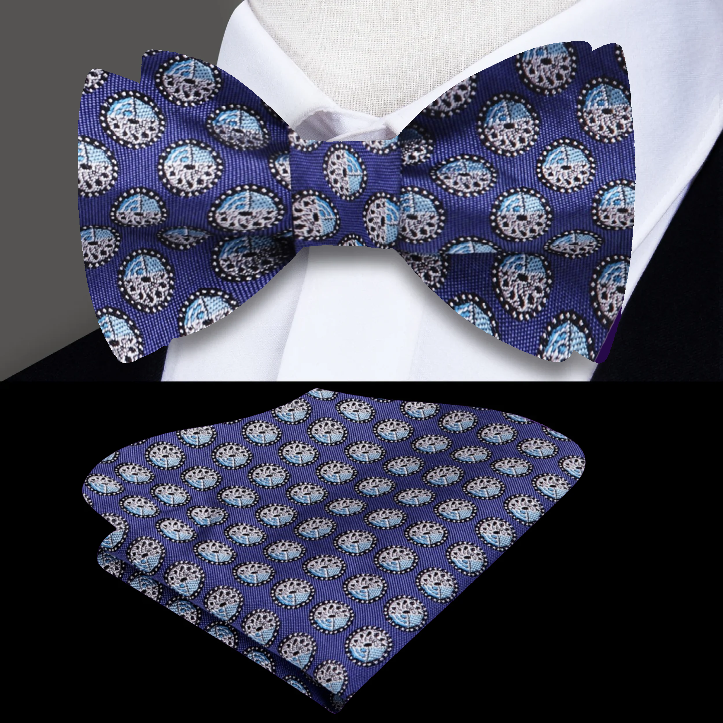 Model wearing plum pattern bow tie, paired with a navy suit.