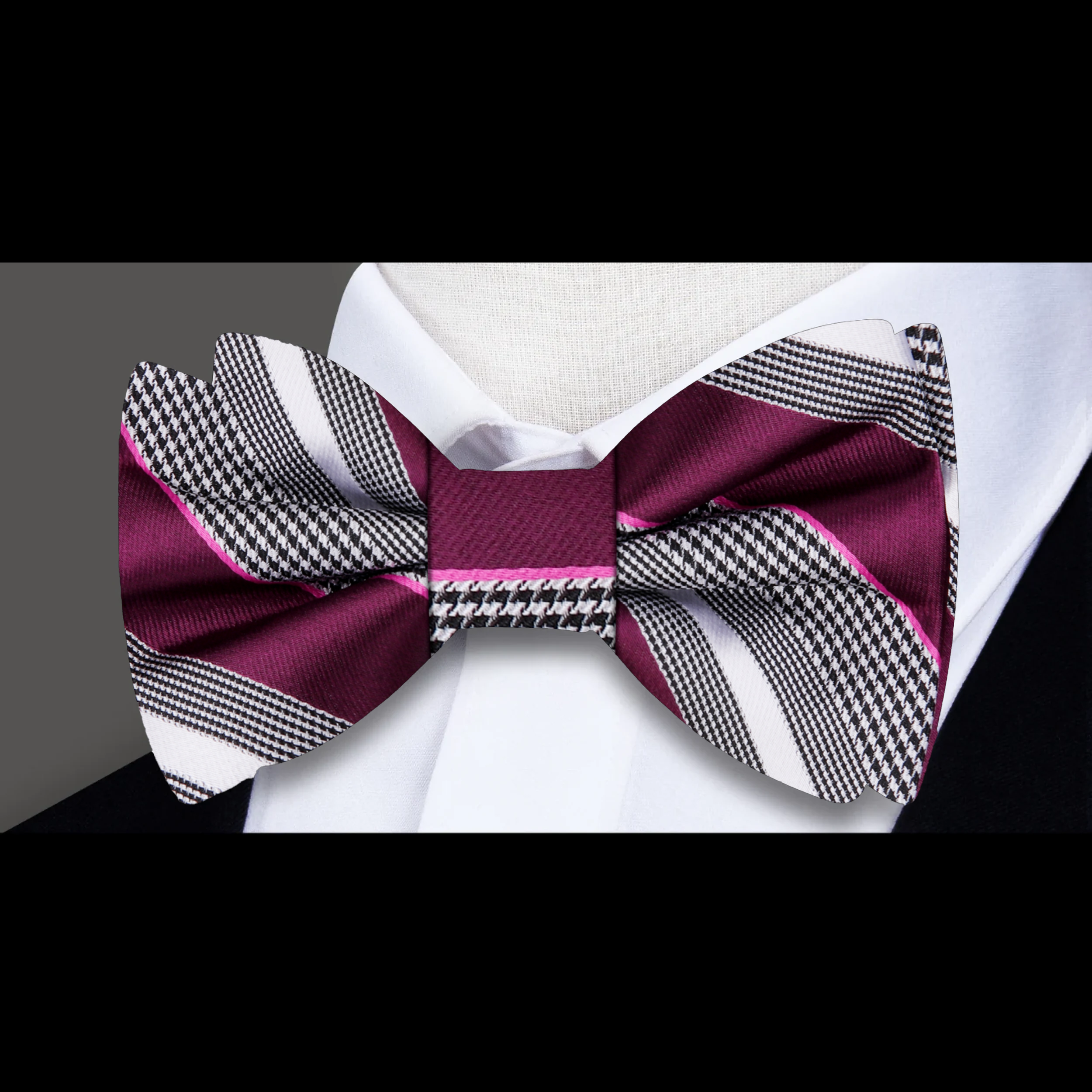 Stylish yellow striped bow tie on a display stand
