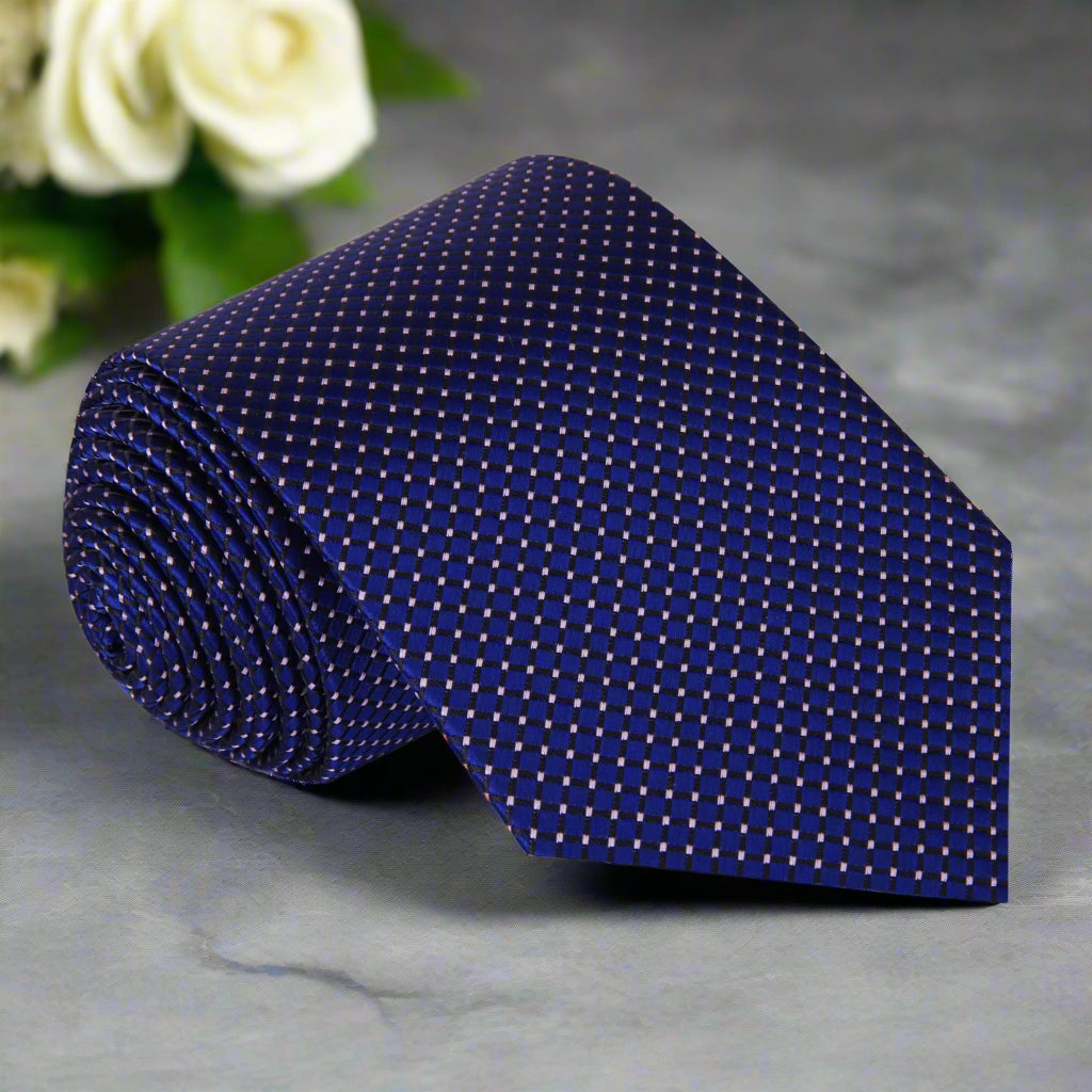 Detail shot of the tie and matching pocket square set, highlighting the modern design suitable for weddings and corporate events.