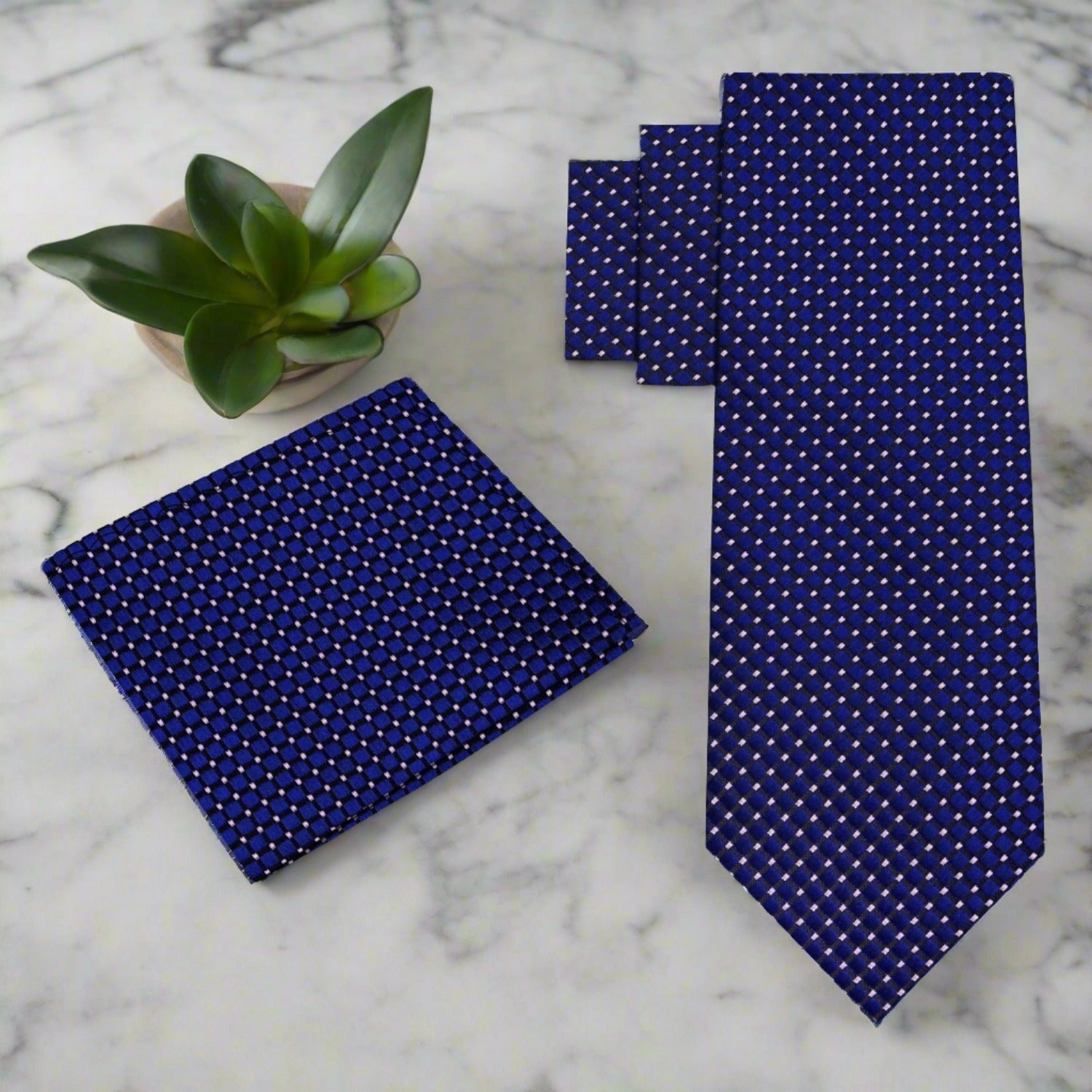 Man wearing a metallic geometric textured silk necktie at a wedding