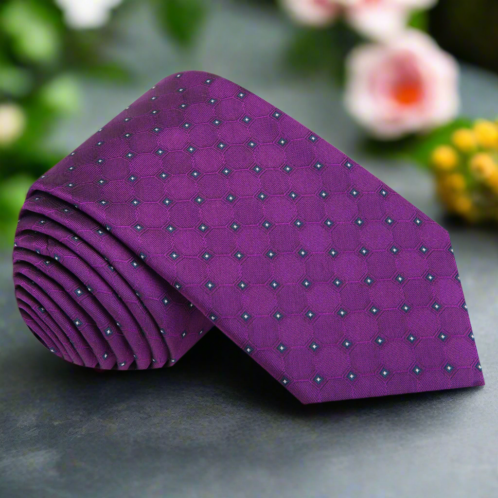 Close-up of the elegant purple geometric necktie showing intricate patterns.