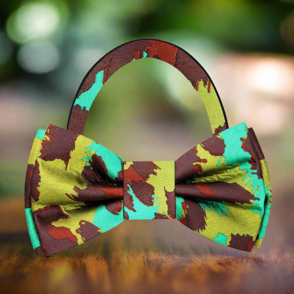 Close-up of bow tie tying process, showcasing natural silk fabric and wild pattern