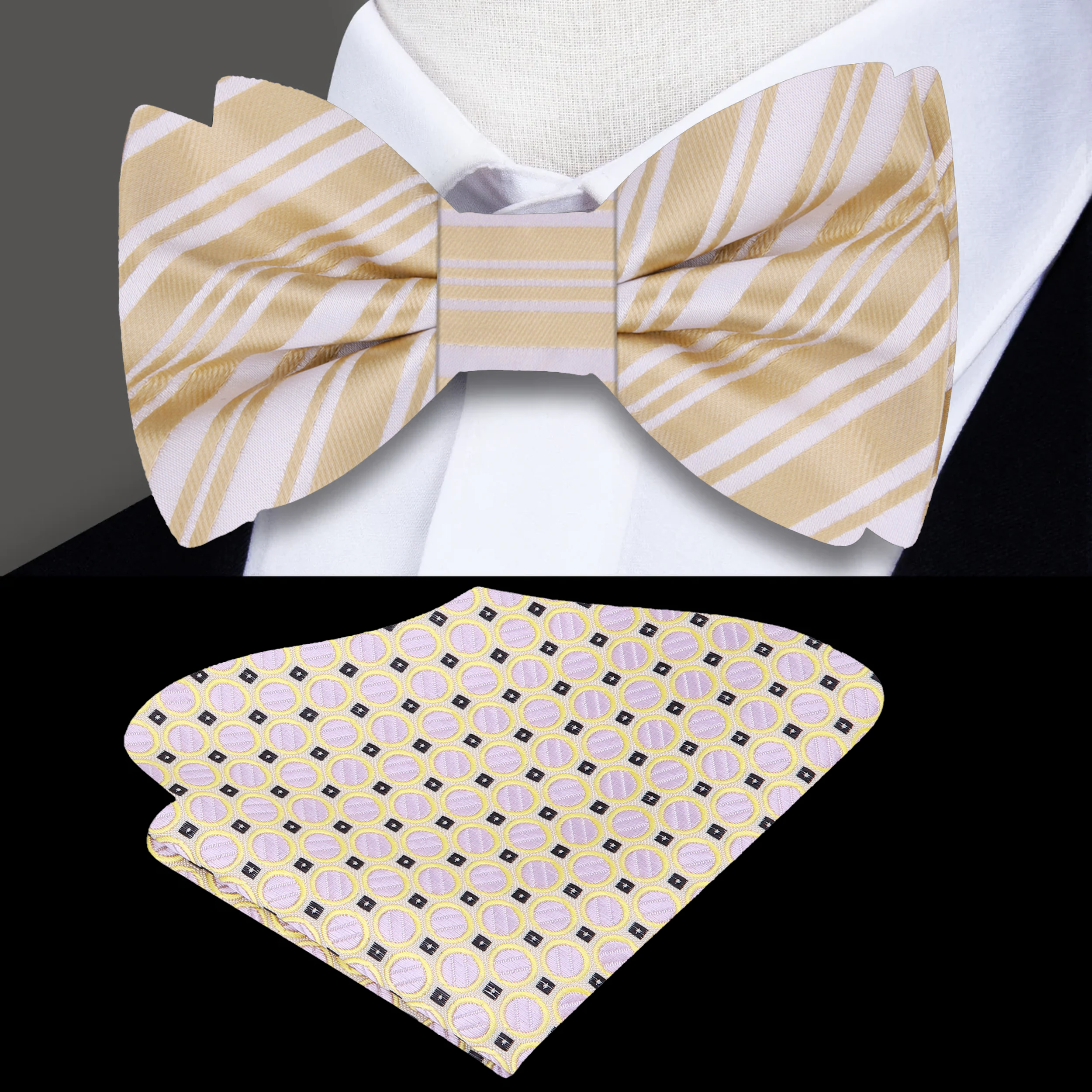 Elegant ivory bow tie with gold stripe, displayed on a wooden surface.