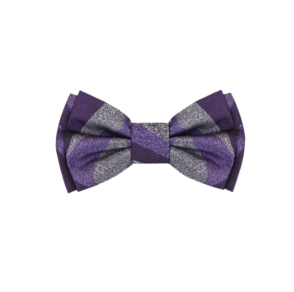 Child wearing a purple bow tie and pocket square at a wedding.