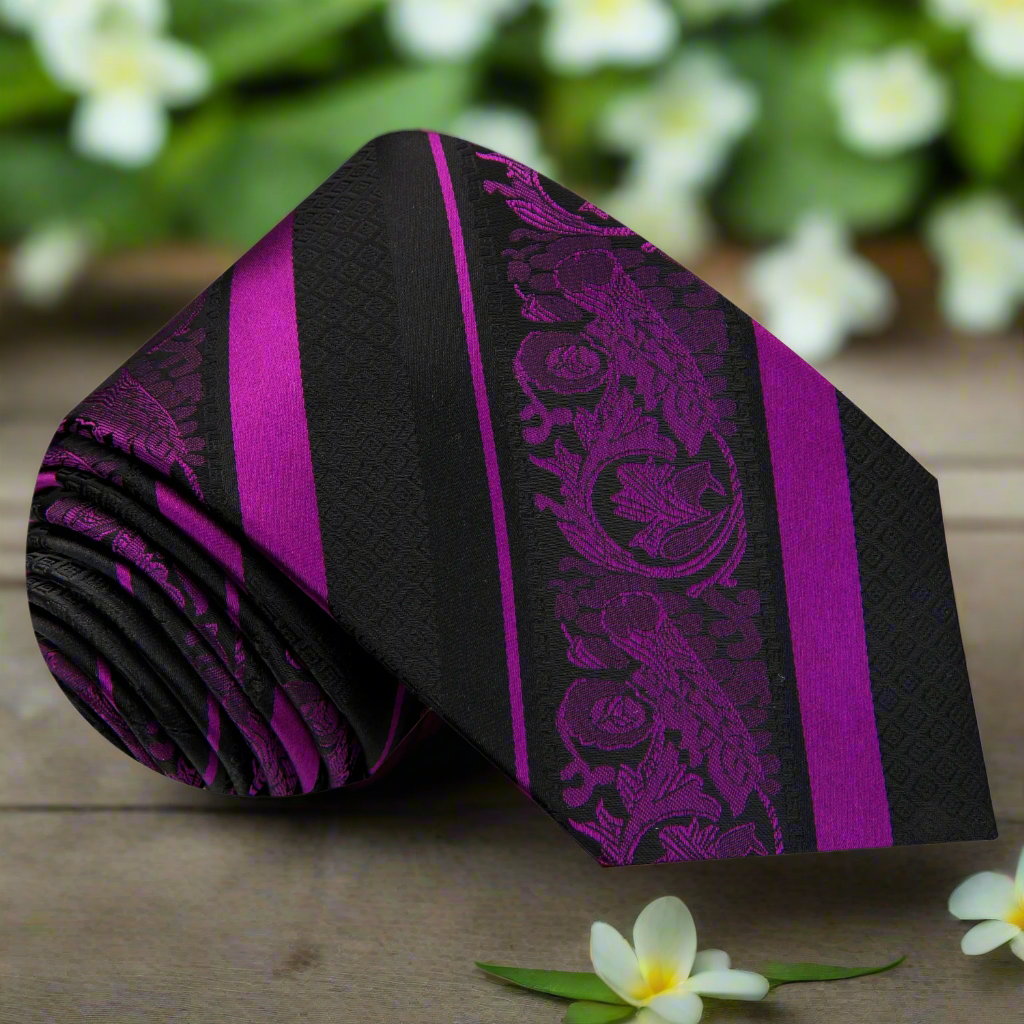 Elegant black and purple paisley silk necktie hanging on a tie rack