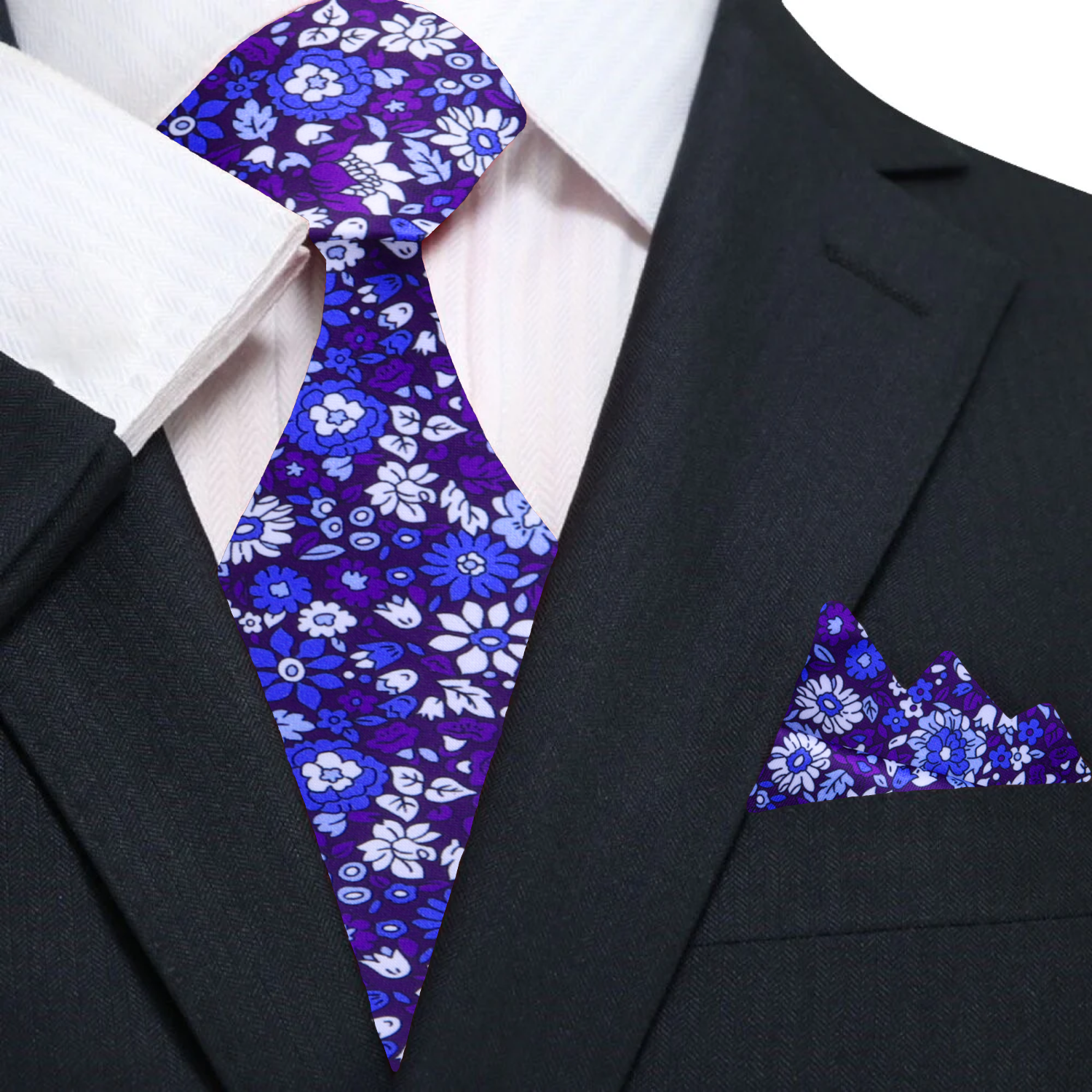 Matching pocket square for blue tie laid out on a suit jacket