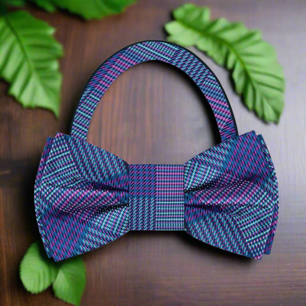 Elegant blue purple plaid silk bow tie displayed on a light grey dress shirt.