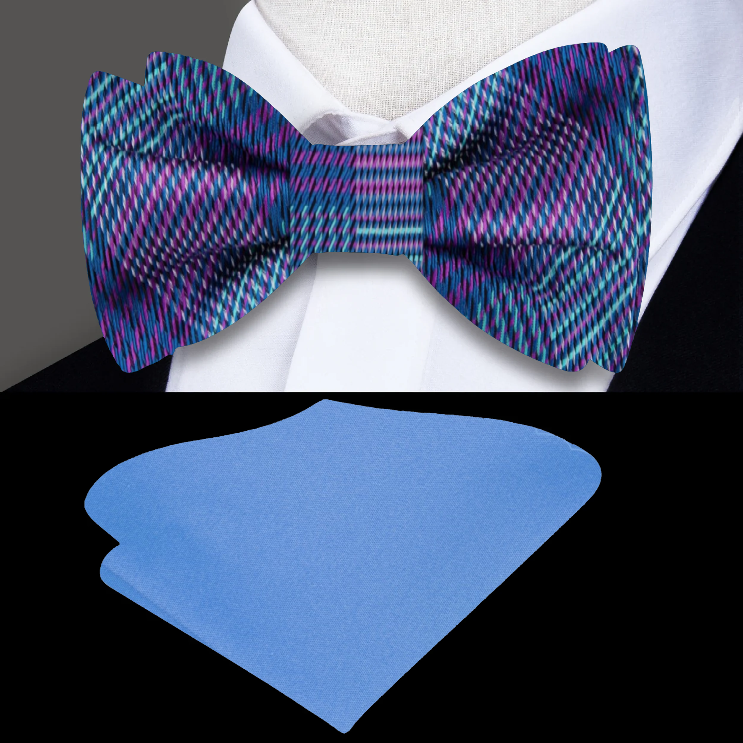Elegant blue purple plaid silk bow tie displayed on a light grey dress shirt.