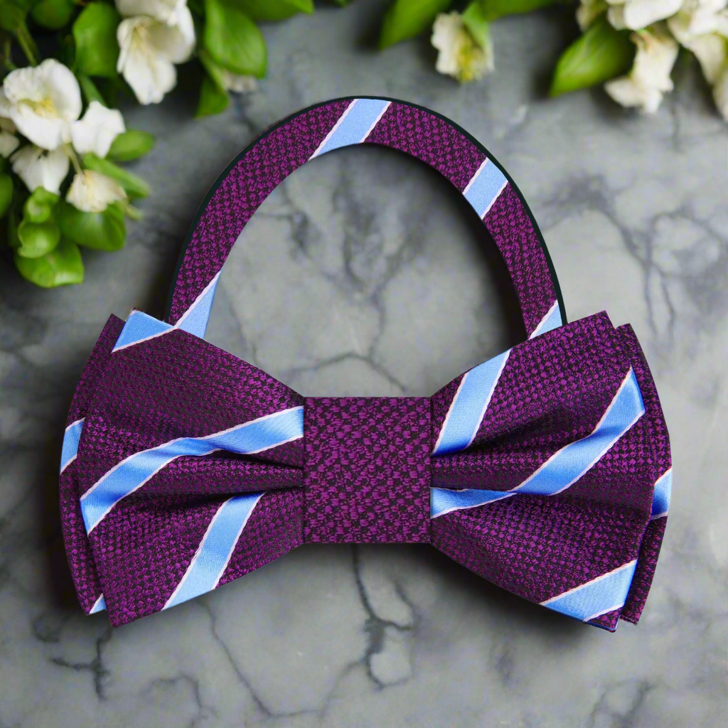 Elegant purple striped bow tie with light blue accents, styled with a suit