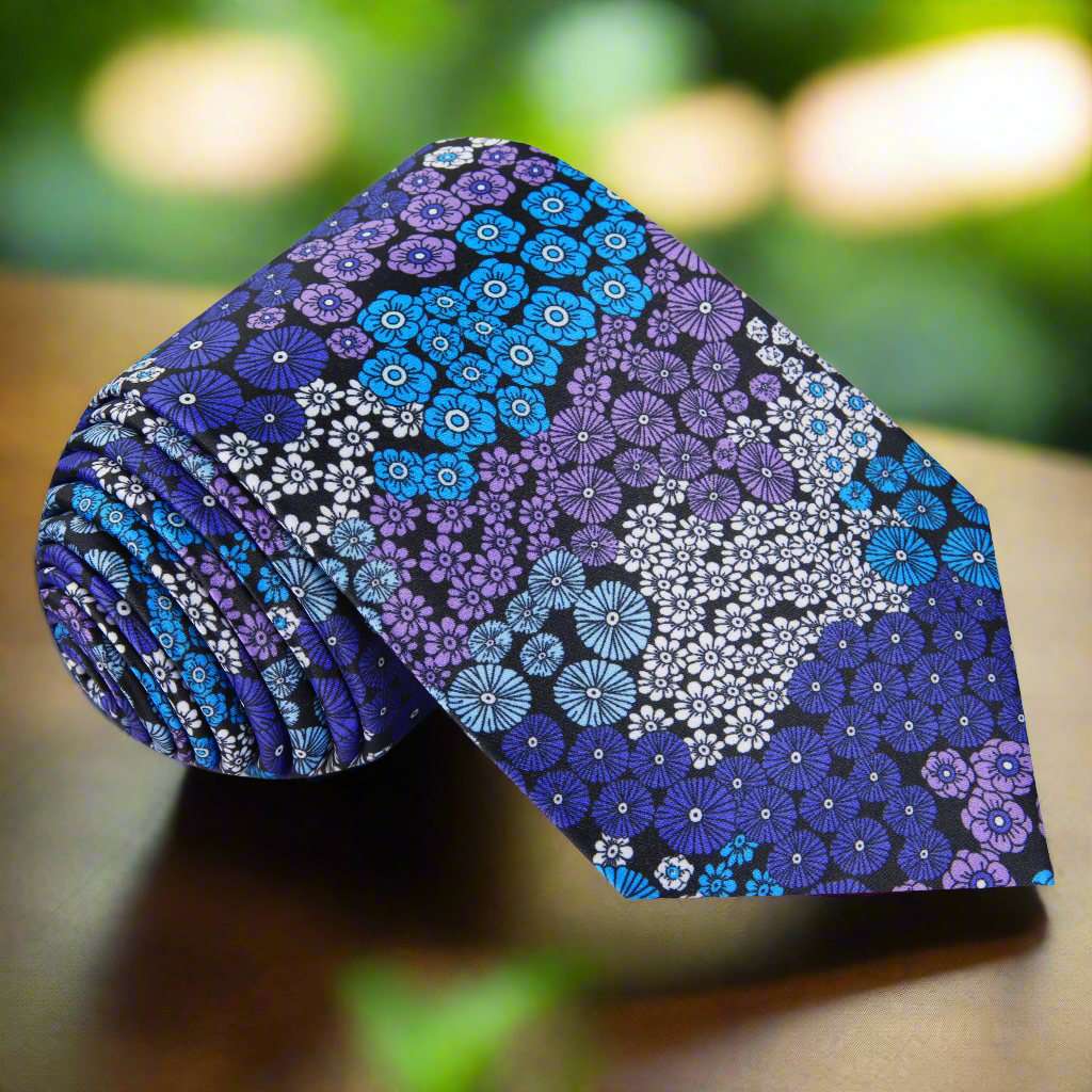 Men's floral silk necktie with purple and blue small flowers, front view