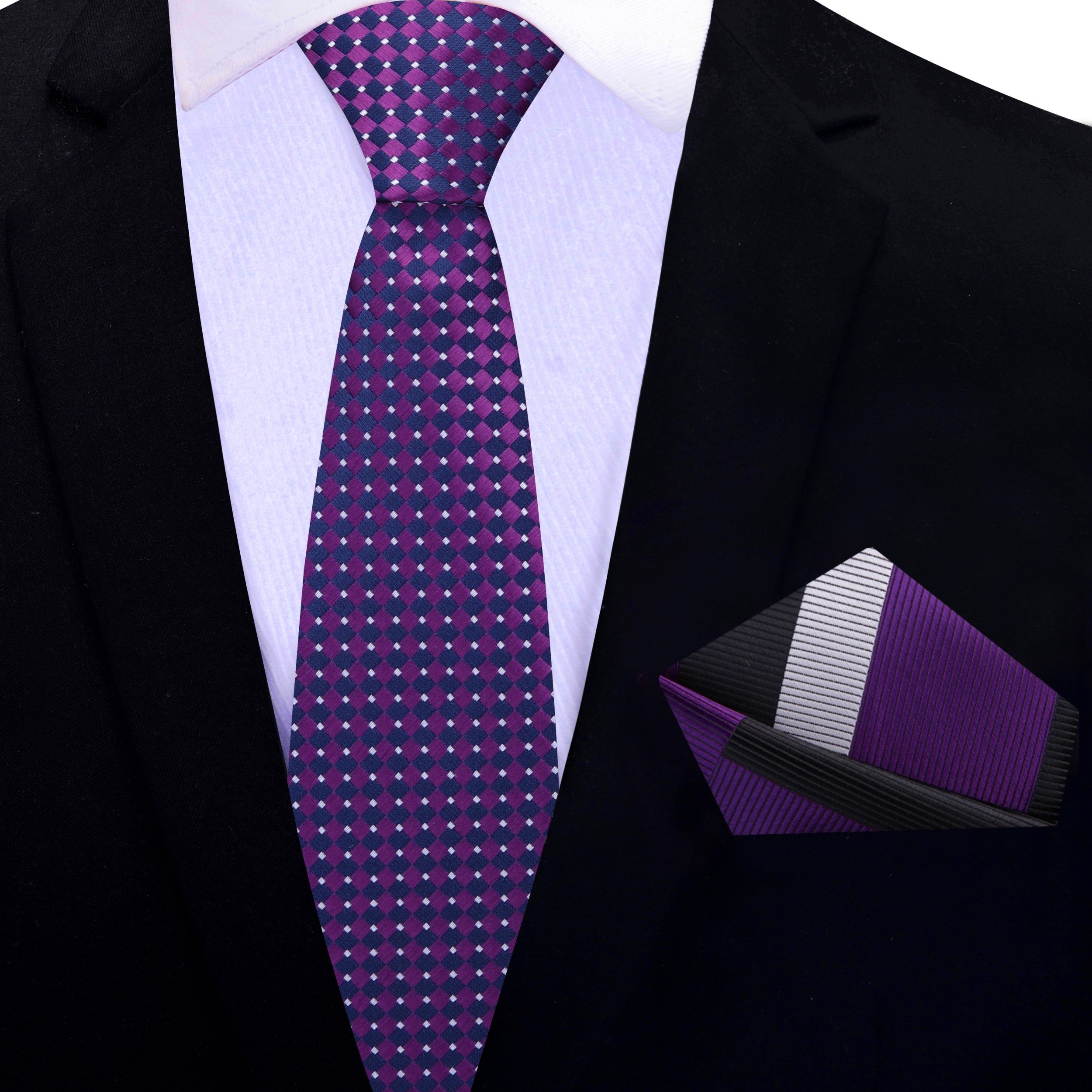 Deep purple necktie paired with a charcoal grey suit, exuding confidence and elegance.