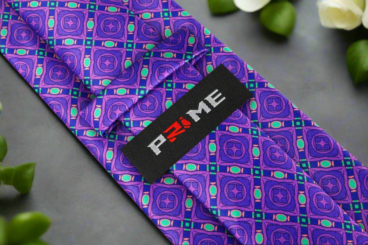 Close-up view of the geometric silk tie highlighting the intricate design and luxurious silk texture.