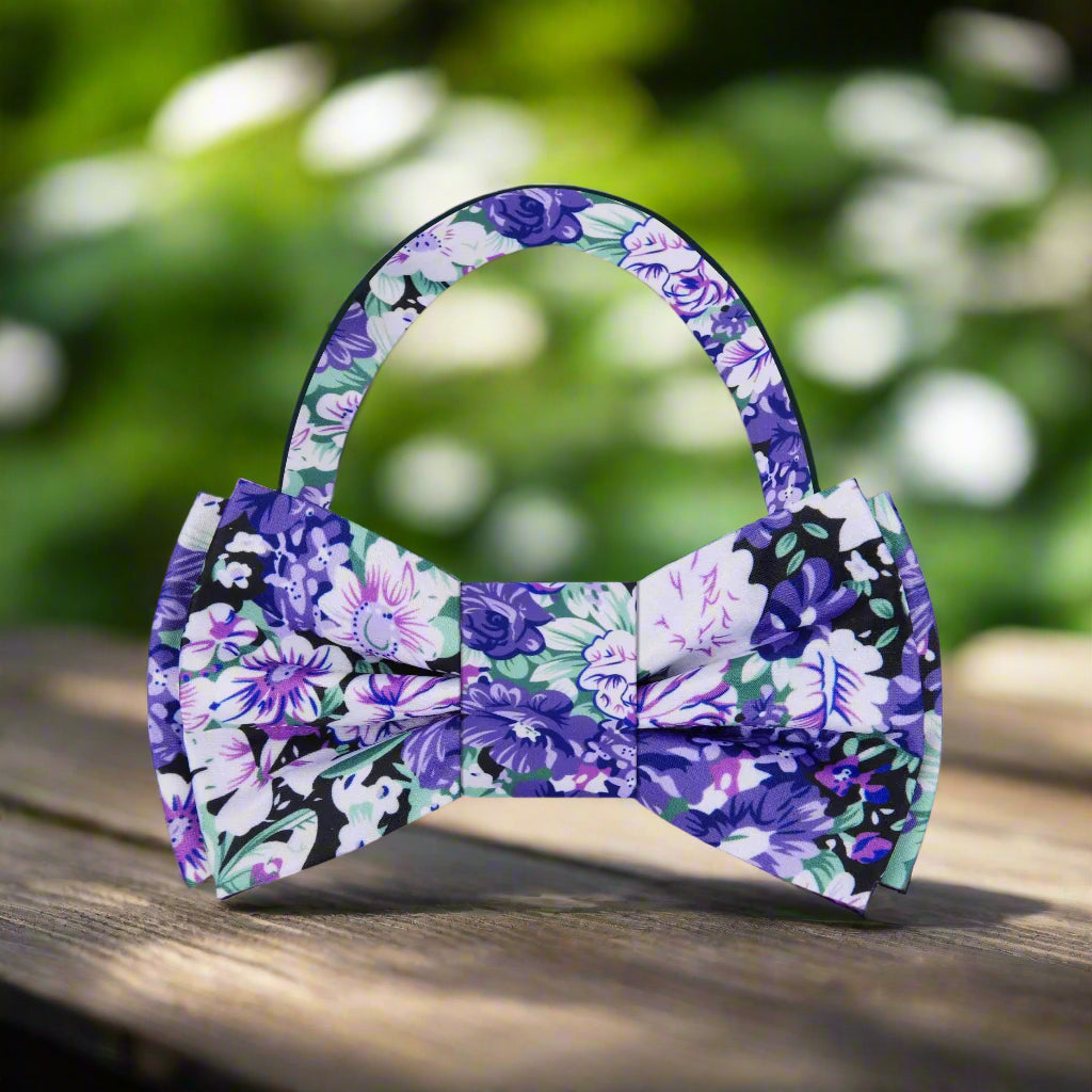 Elegant floral bow tie in purple, green, and white with detailed botanical pattern