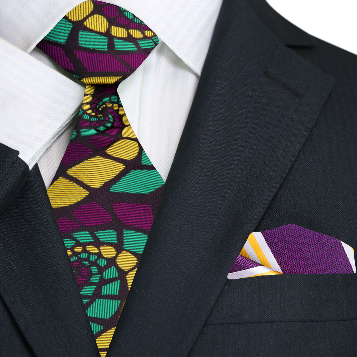 Folded silk tie in green draped across a suit jacket, styled for an upscale evening look