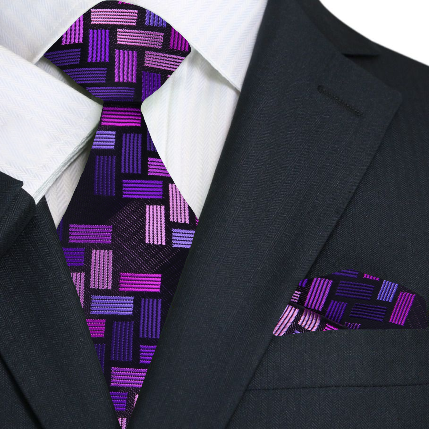 Close-up of the purple silk tie showcasing its intricate jigsaw geometric pattern.
