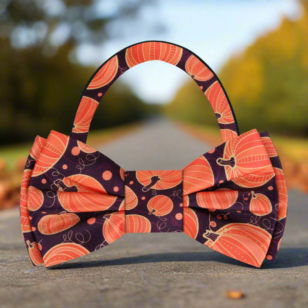 Autumn Harvest Pumpkin Bow Tie displayed with a matching pocket square, perfect for Thanksgiving celebrations.