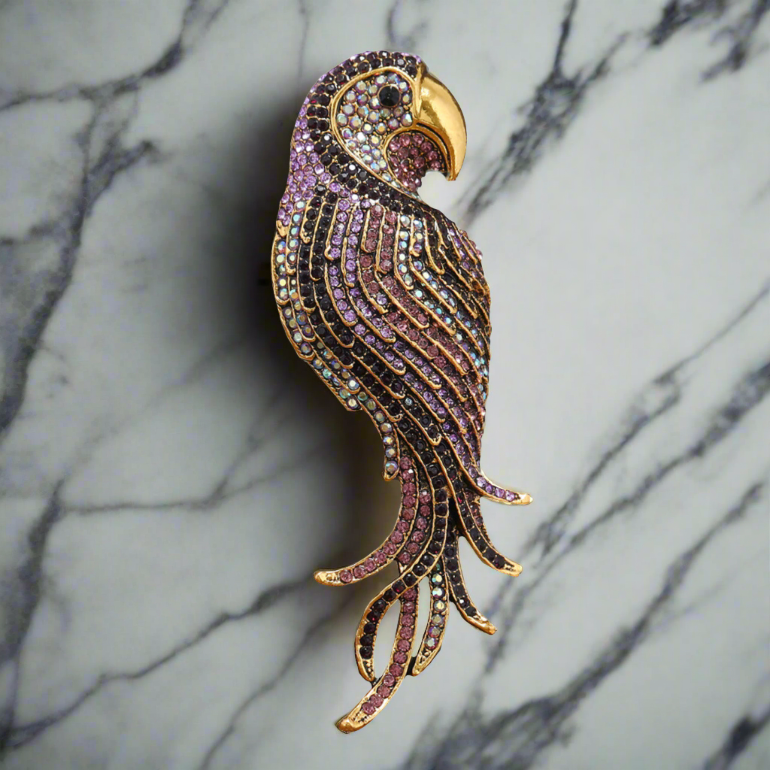 Red exotic bird lapel pin with detailed craftsmanship, perfect for formal attire