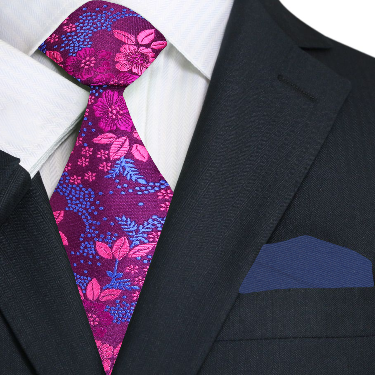 Purple floral necktie styled with a light blue dress shirt and grey suit for a professional look.