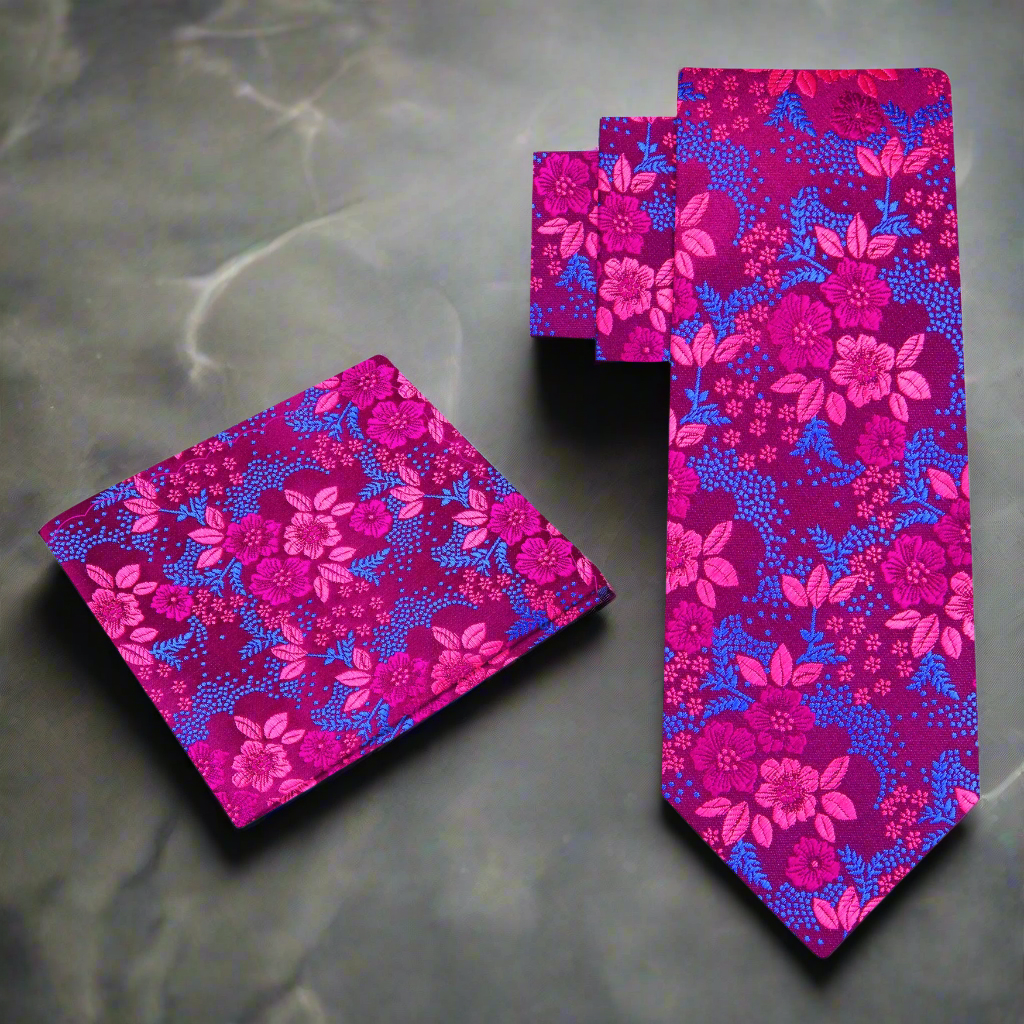 Close-up of charming purple floral necktie showcasing light blue and pink flower patterns.