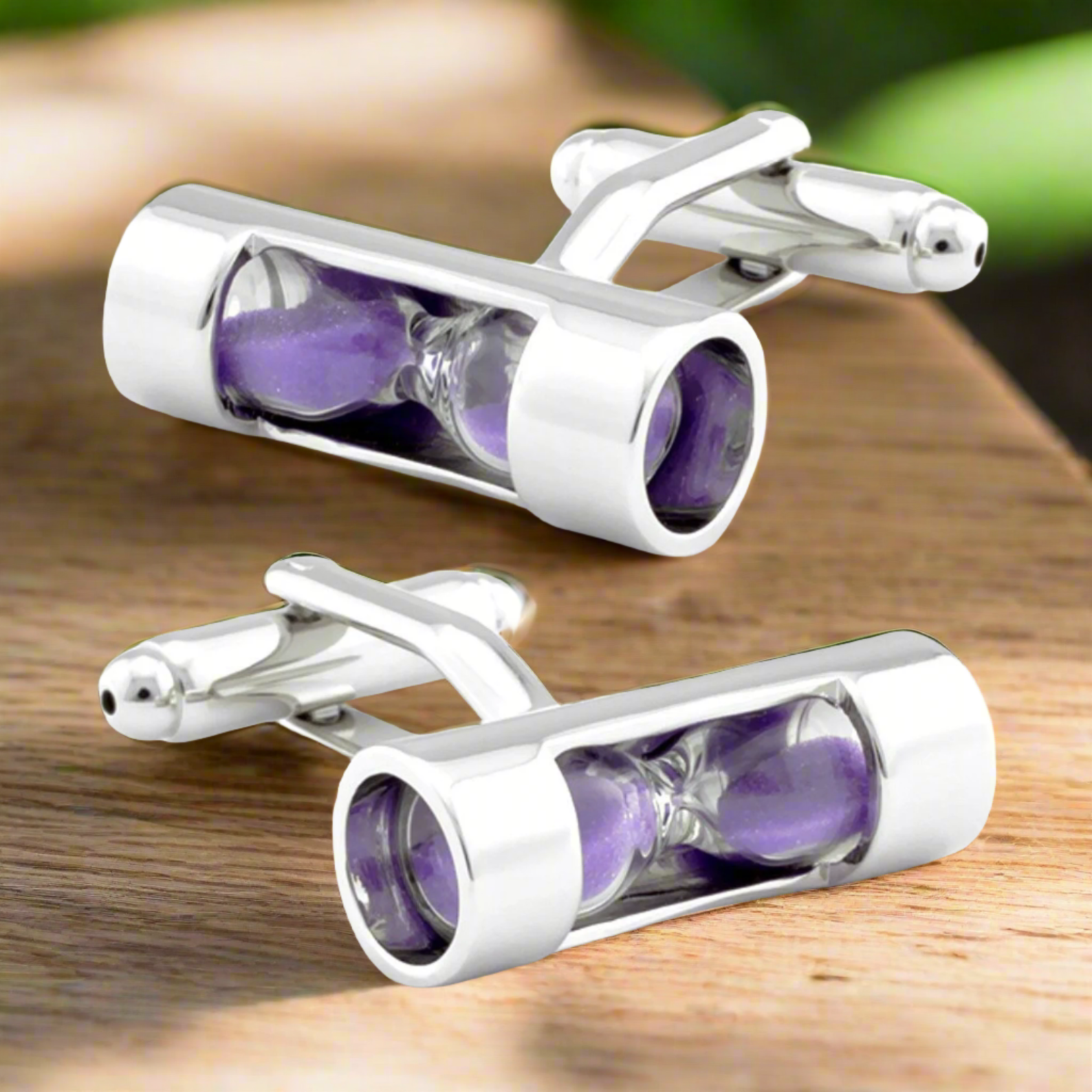 Elegant hourglass cufflinks with white sand, shining under formal lighting