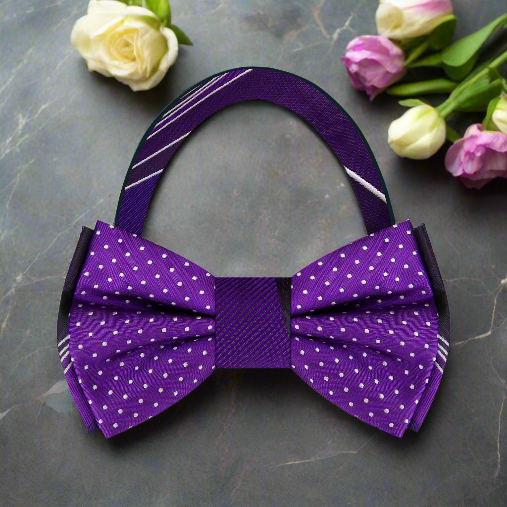 Close-up of men's reversible bow tie with abstract purple lines pattern