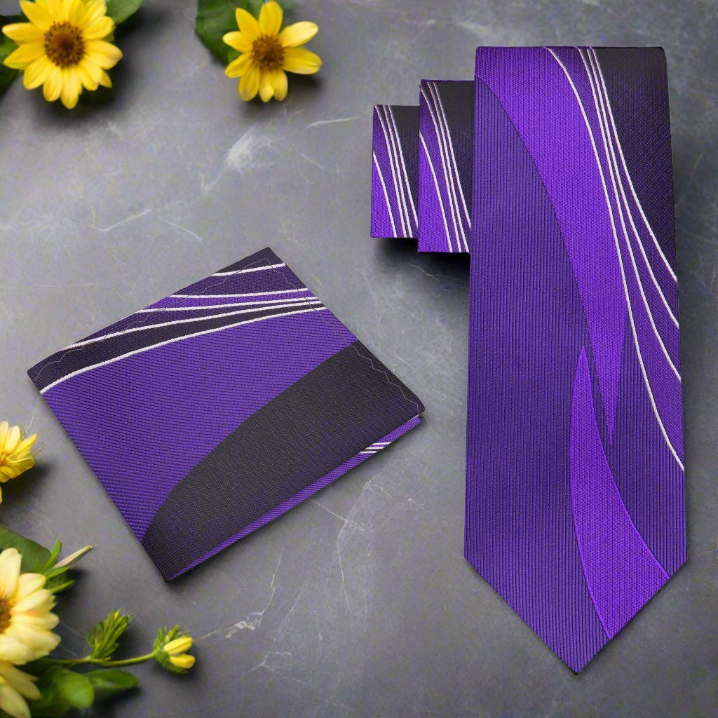 Vibrant purple silk necktie with abstract design, displayed on a formal shirt.