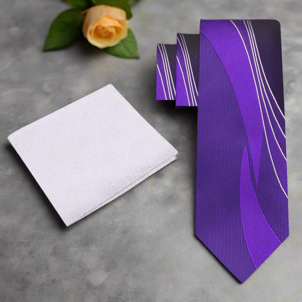 Vibrant purple silk necktie with abstract design, displayed on a formal shirt.