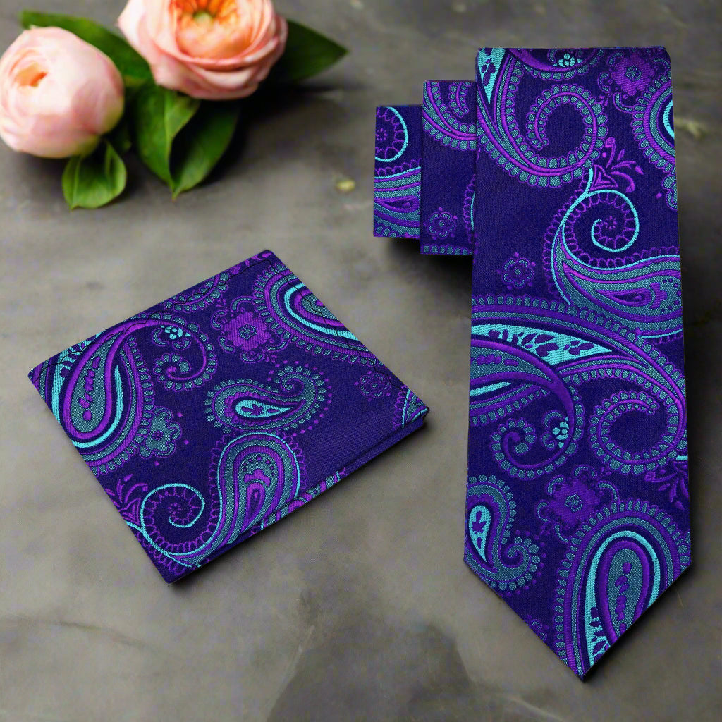 Elegant navy blue suit with matching paisley silk necktie and pocket square