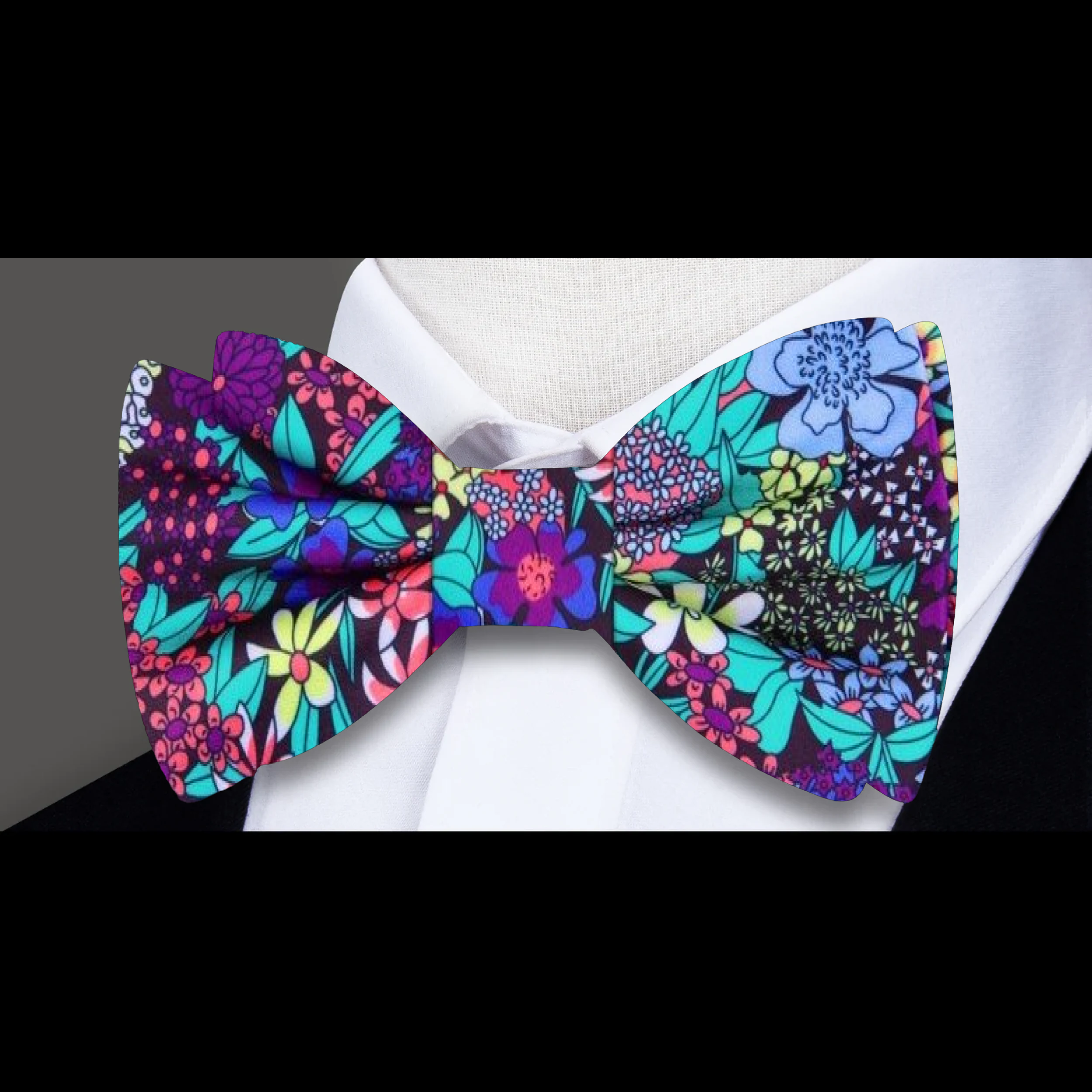 Man adjusting floral bow tie for wedding or formal occasion