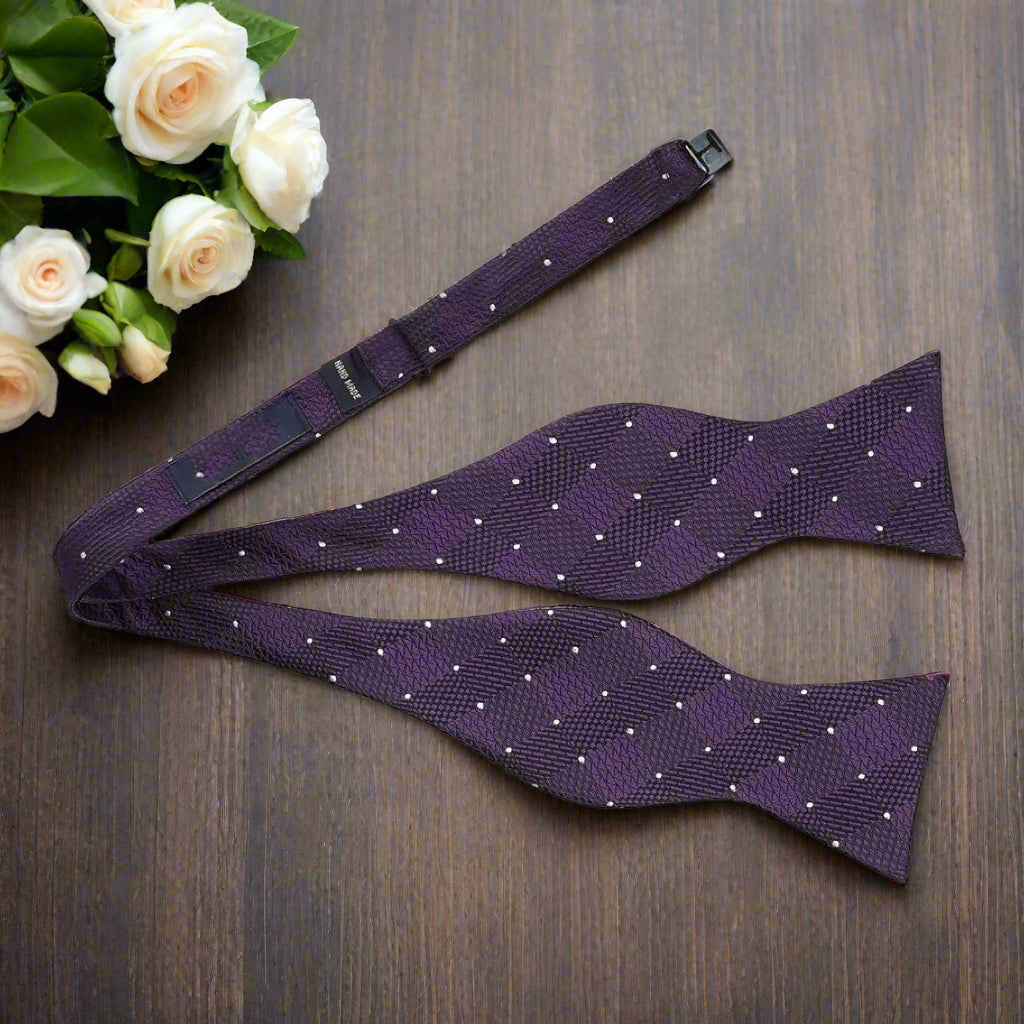 Elegant men’s outfit pairing the geometric silk bow tie with a white textured shirt