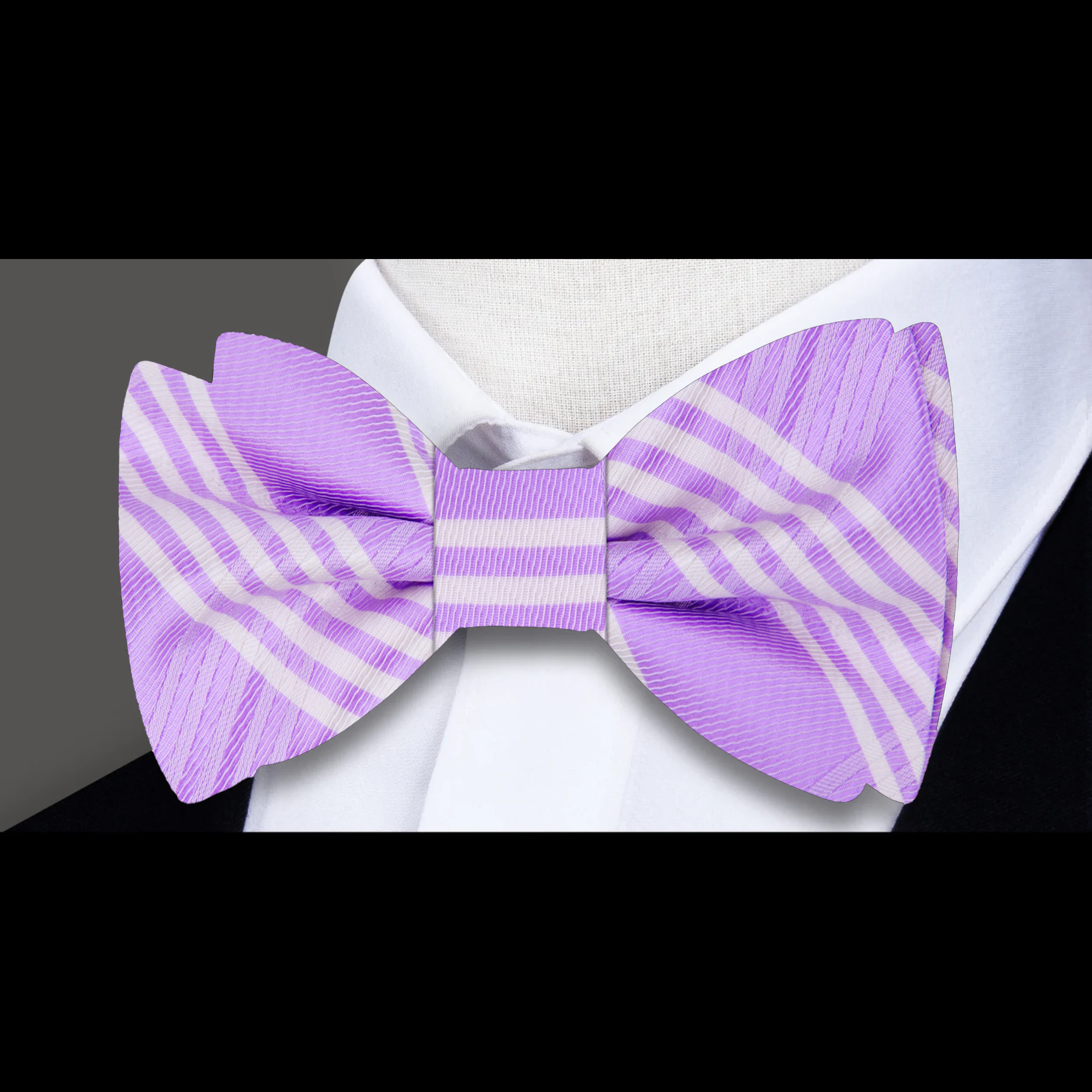 Close-up of the light purple plaid silk bow tie, highlighting its intricate pattern.