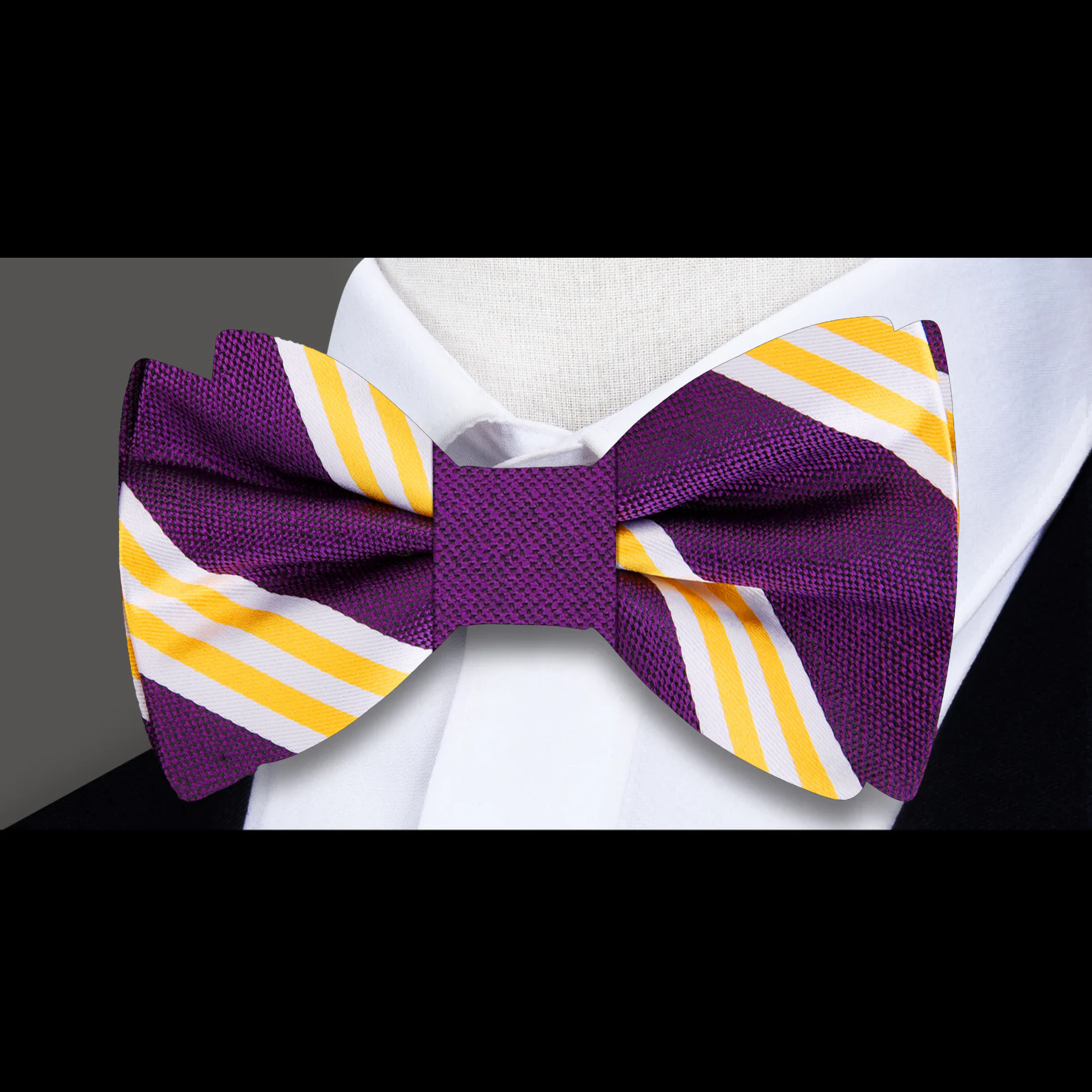 Man adjusting a pre-tied mens bow tie for wedding attire