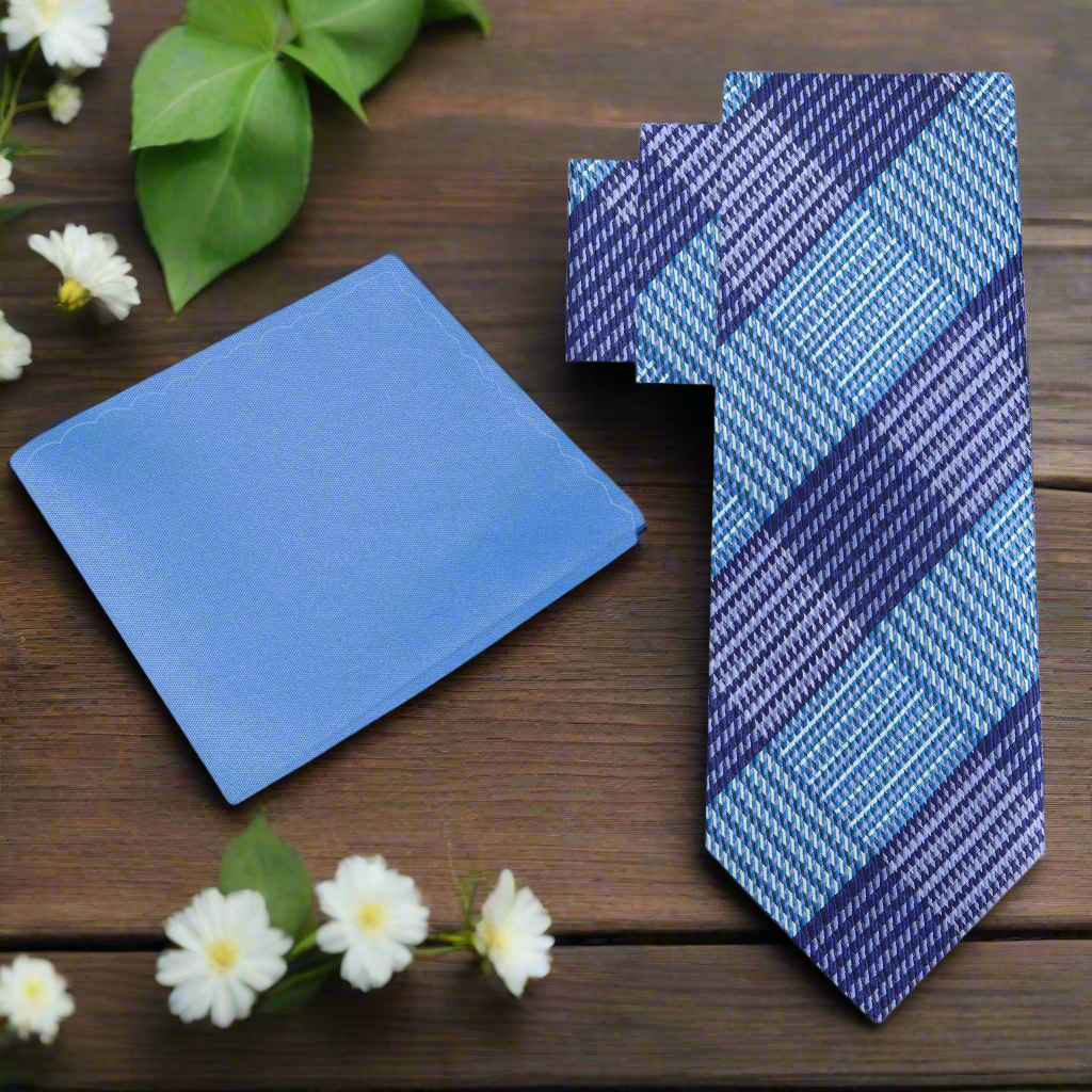 Elegant purple and blue silk plaid tie draped over a white shirt for formal occasions