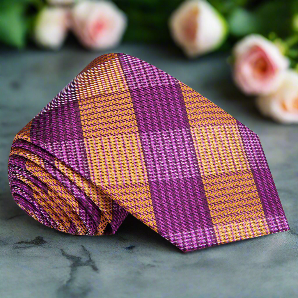 Close-up of luxurious silk plaid necktie in purple and orange for formal wear